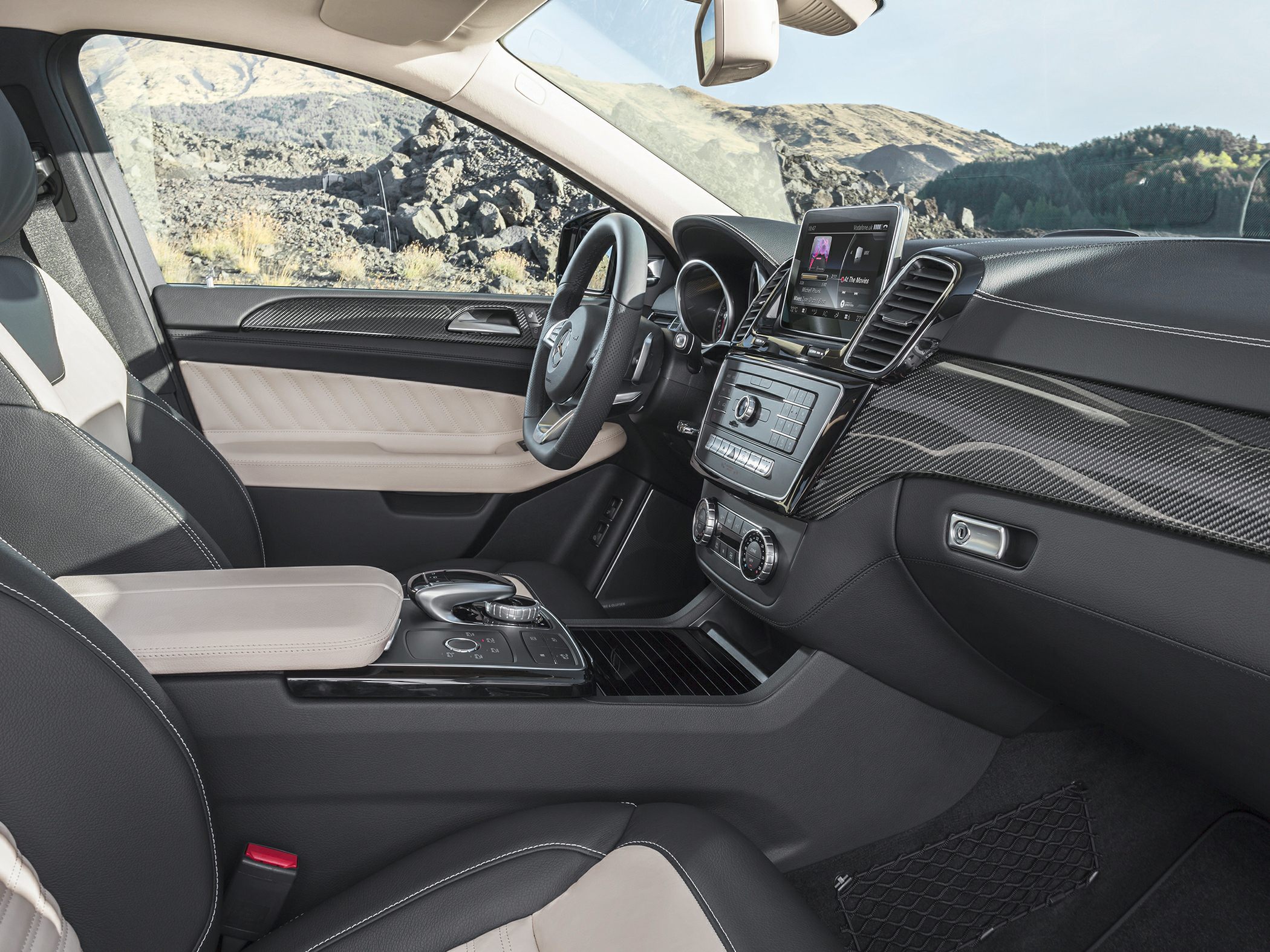 Luxury interior with digital infotainment and carbon fiber trim