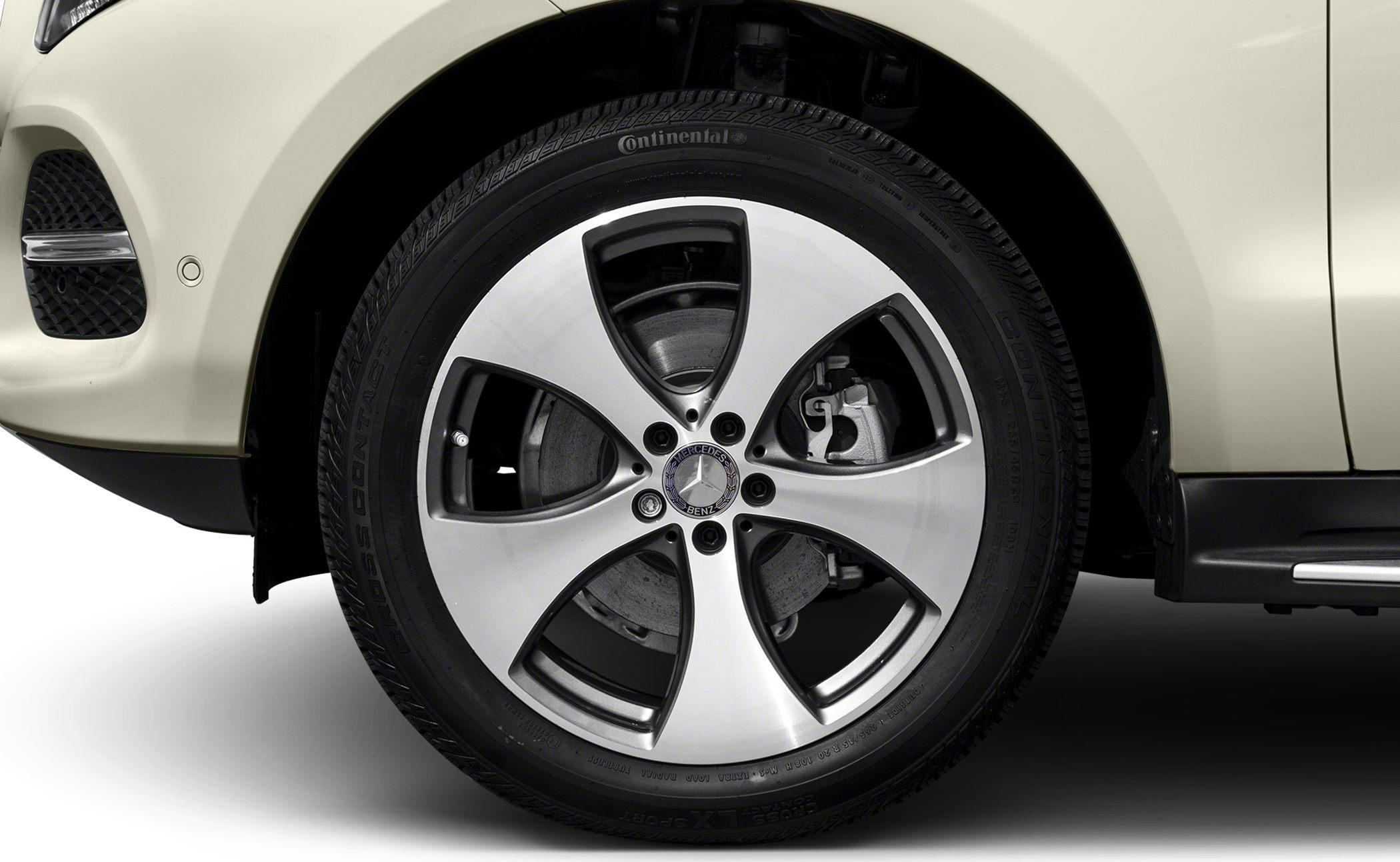 Close-up of alloy wheel with Continental tire and visible brake caliper.