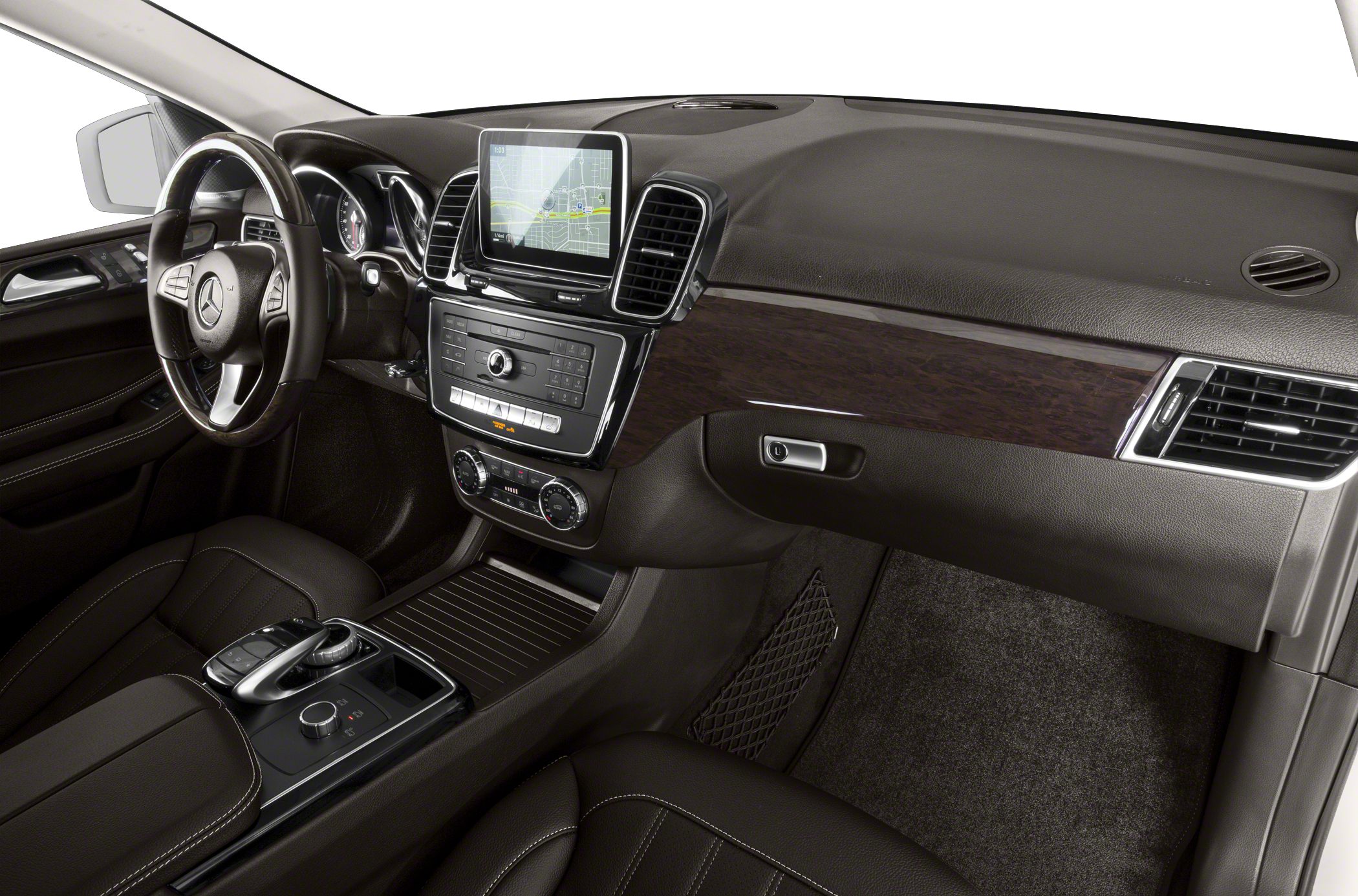 Luxury SUV interior with wood trim, infotainment screen, and advanced controls