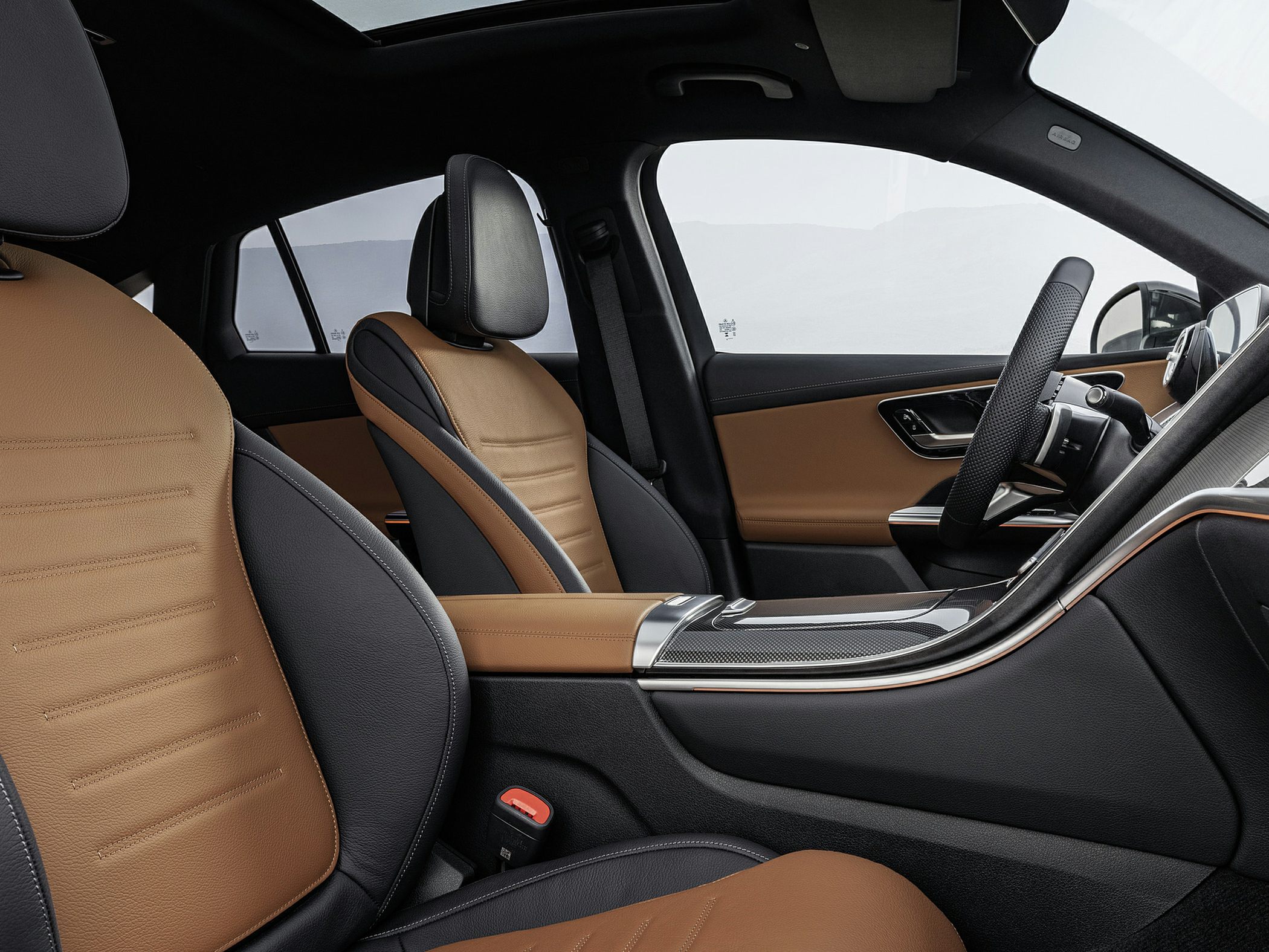 Two-tone brown and black leather seats with modern trim and ergonomic design