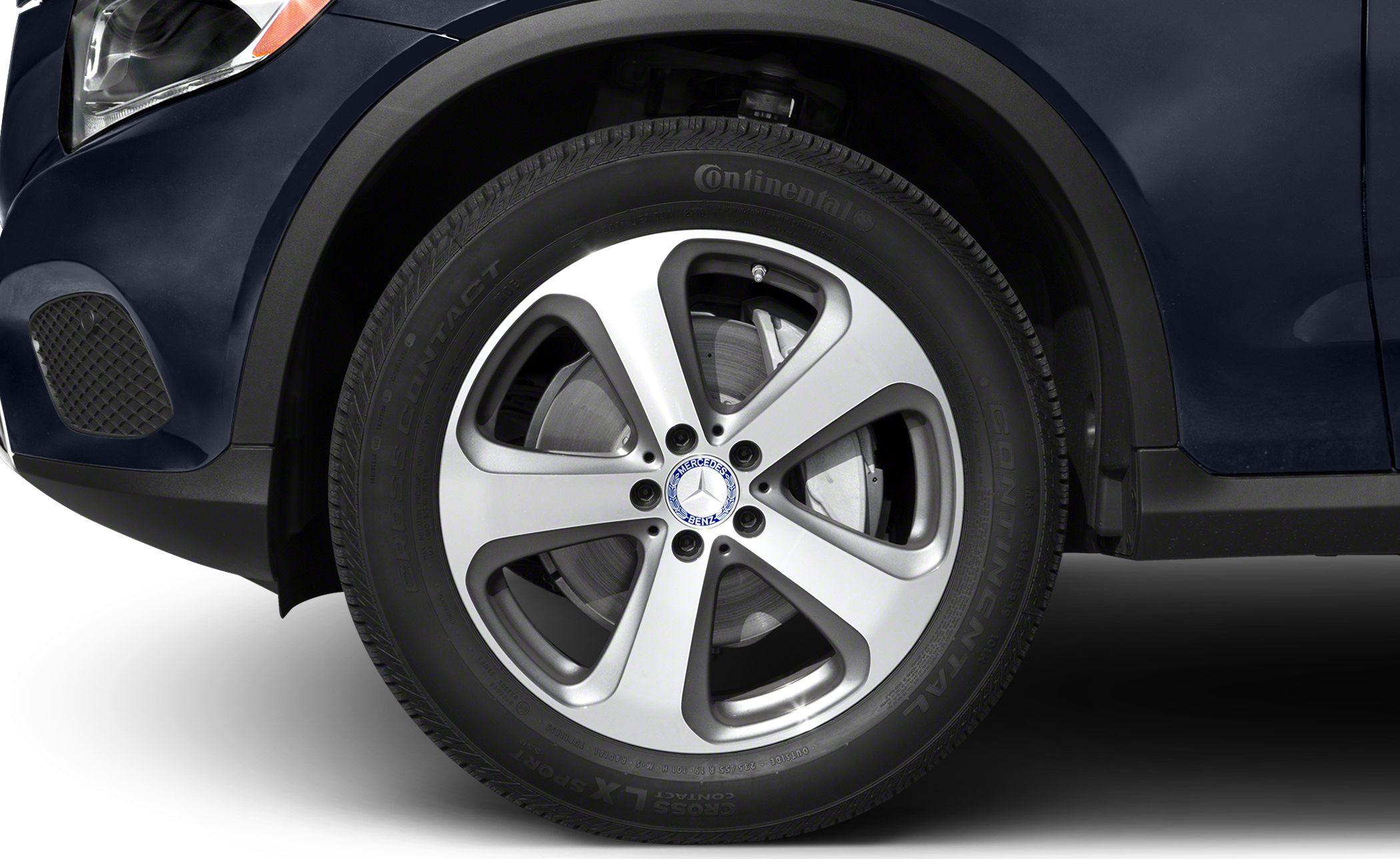 Alloy wheel with brake disc and Continental tire on SUV wheel arch