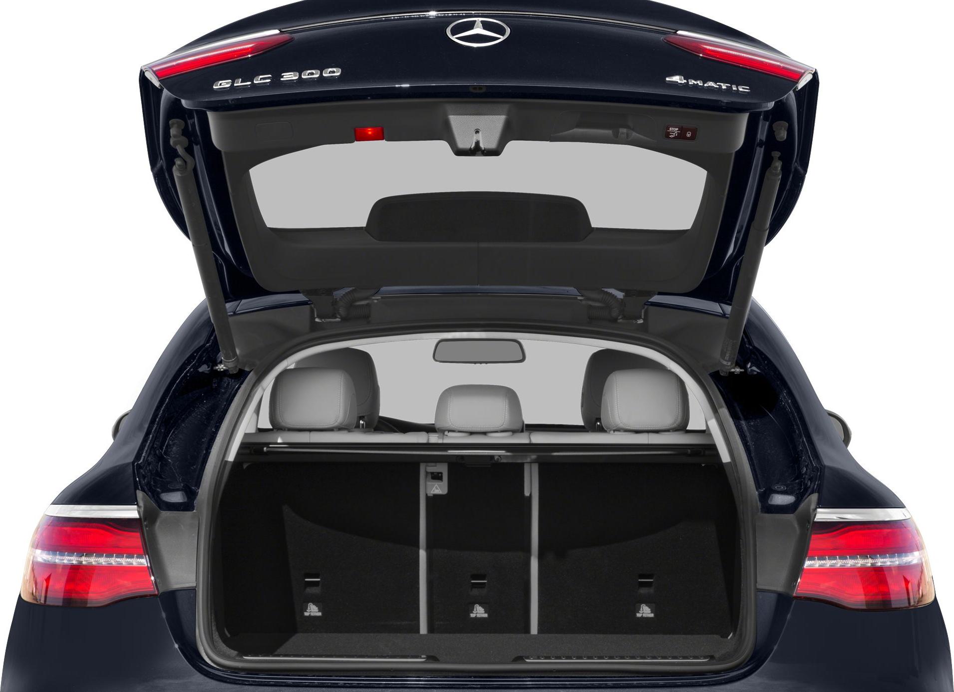 Open trunk with visible rear seats and 4MATIC badge on a coupe SUV rear.