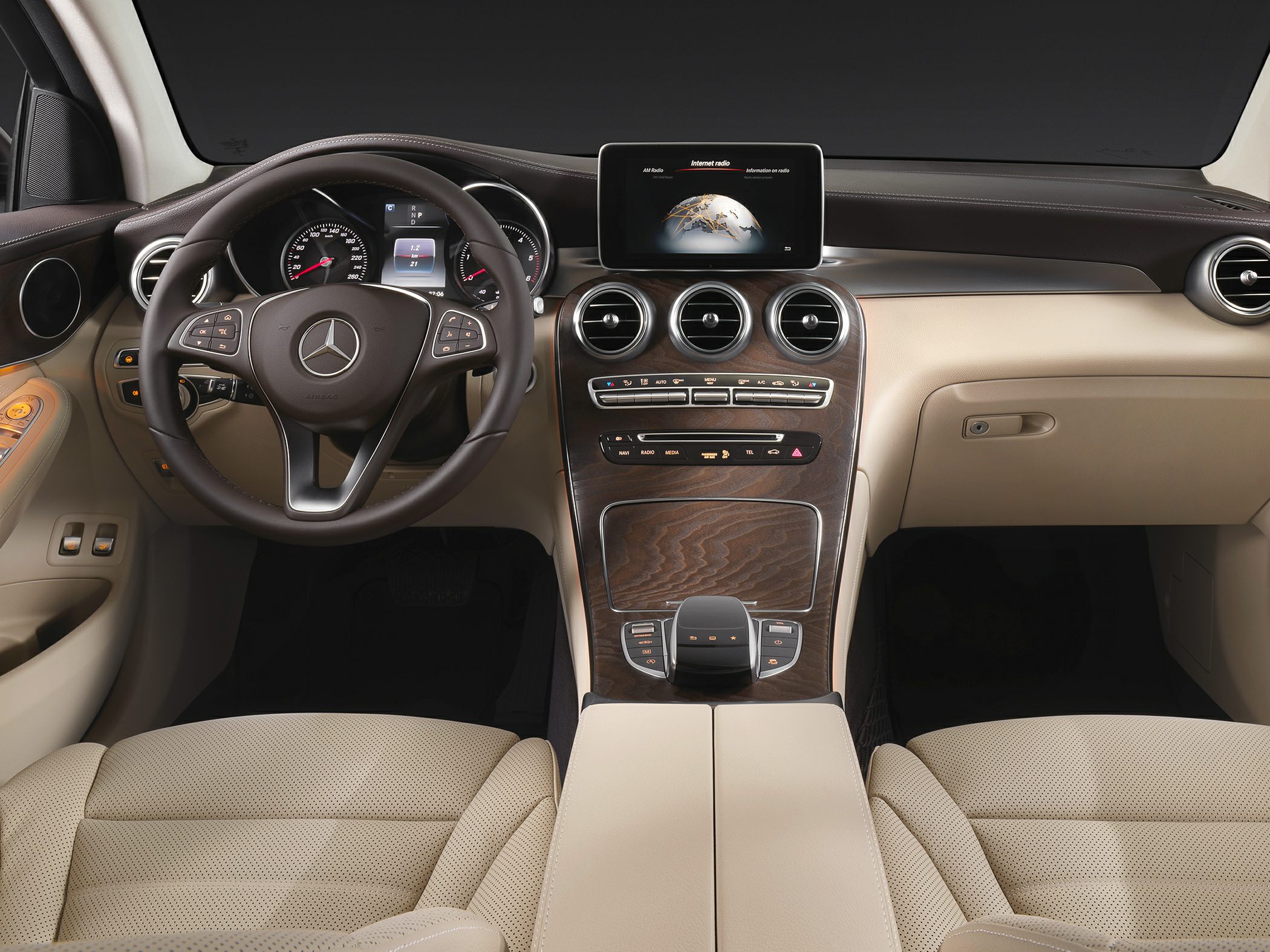 Sophisticated dashboard and multifunction steering wheel with infotainment screen.