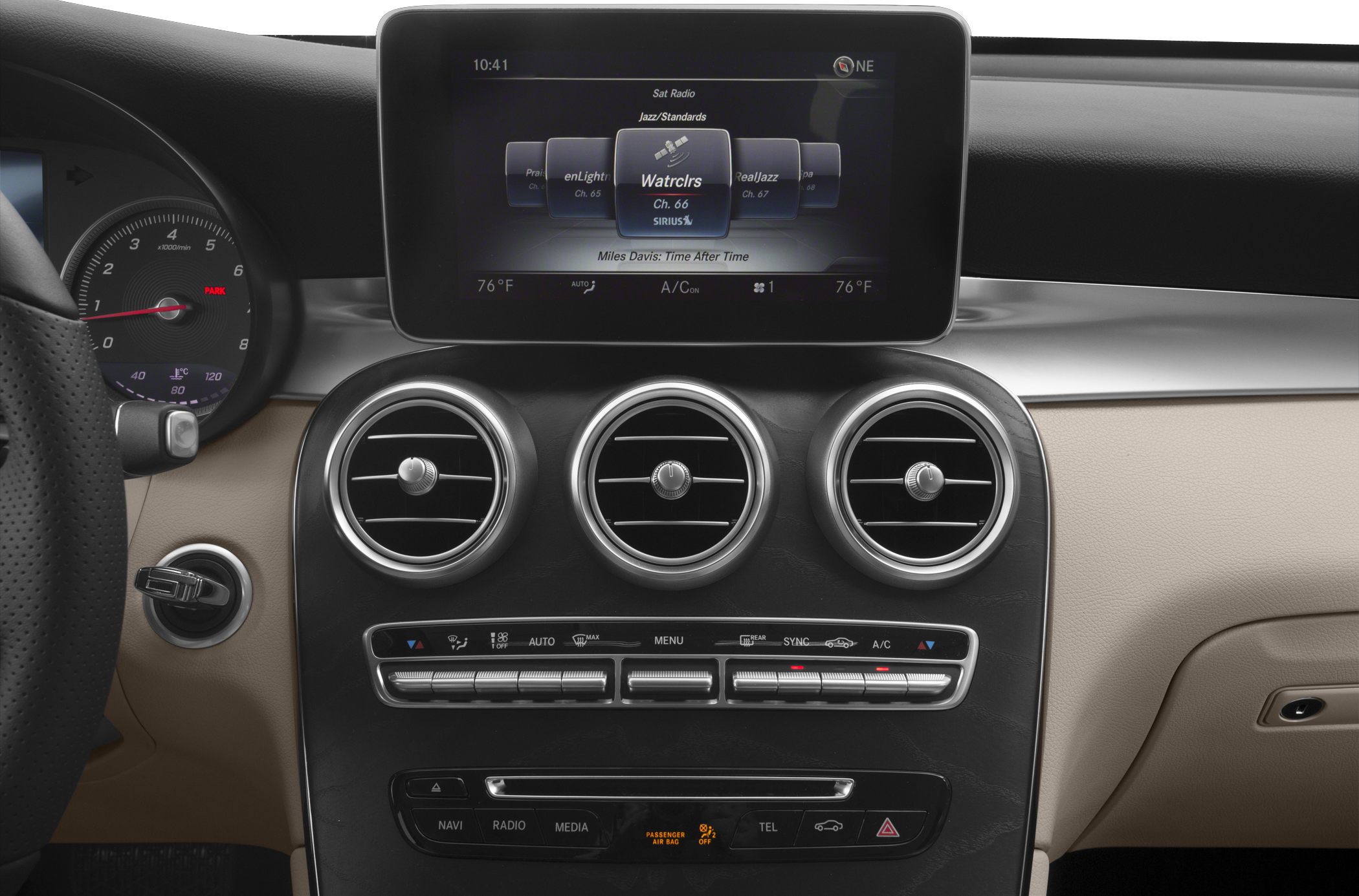 Central multimedia screen with three circular air vents and climate control buttons