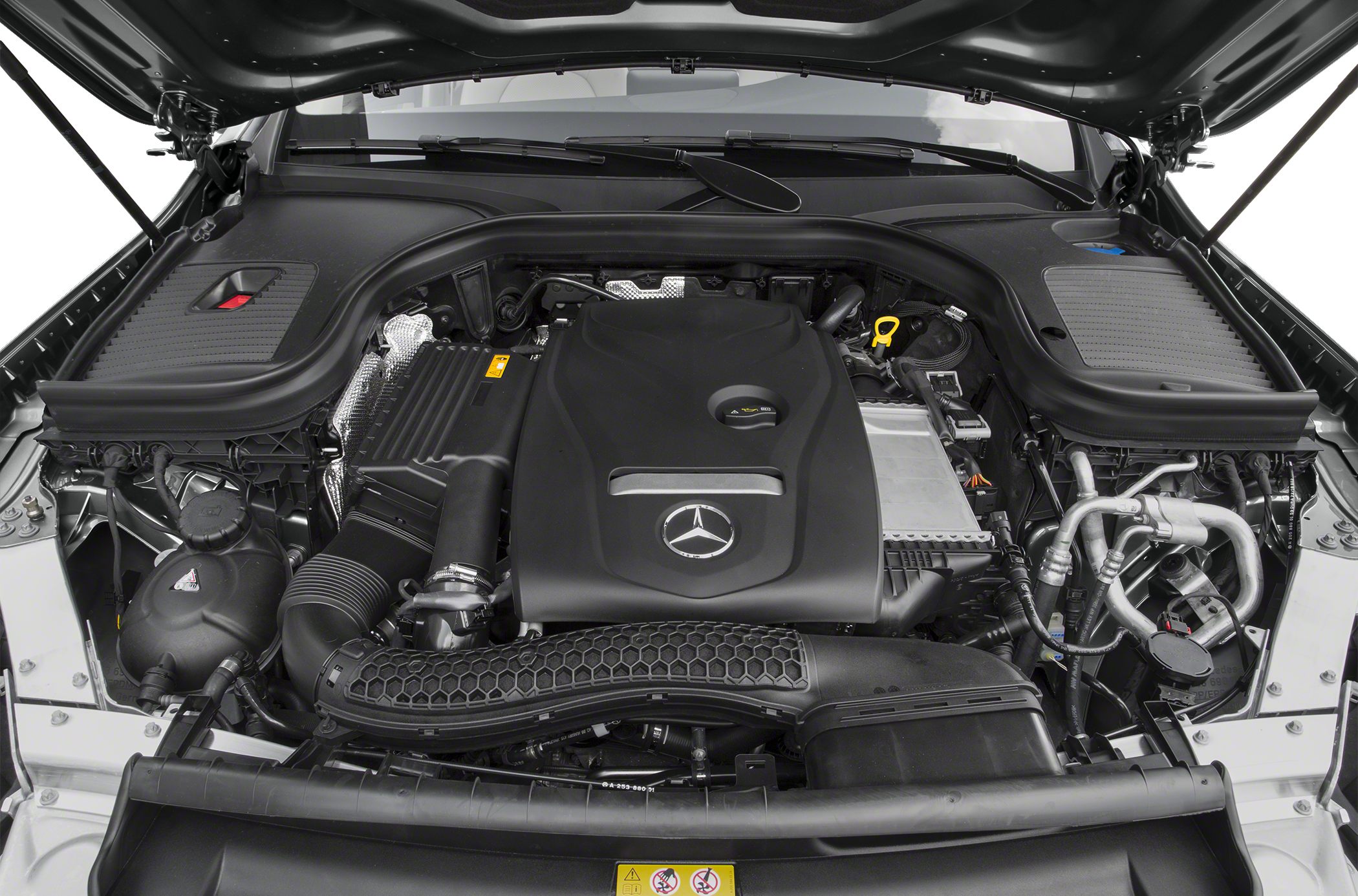 Mercedes-Benz SUV engine bay with engine cover and intake system.