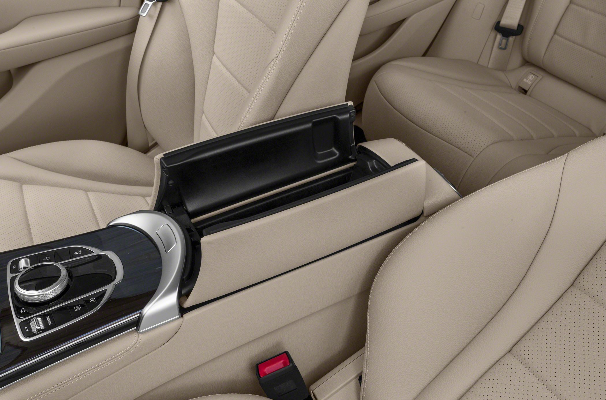 Beige leather seats and open center armrest storage with control console