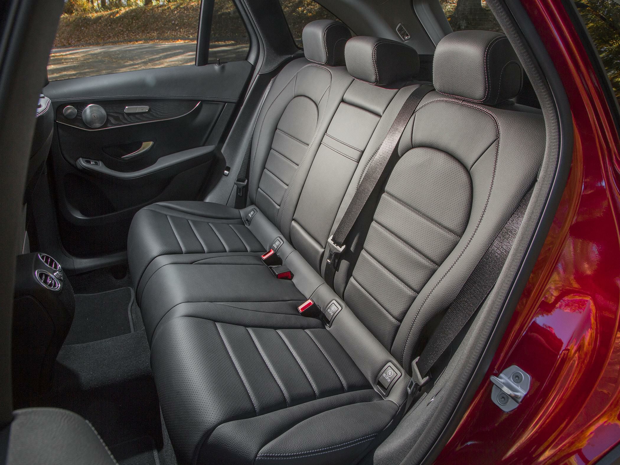 Spacious rear leather seating with seat belts and door panel