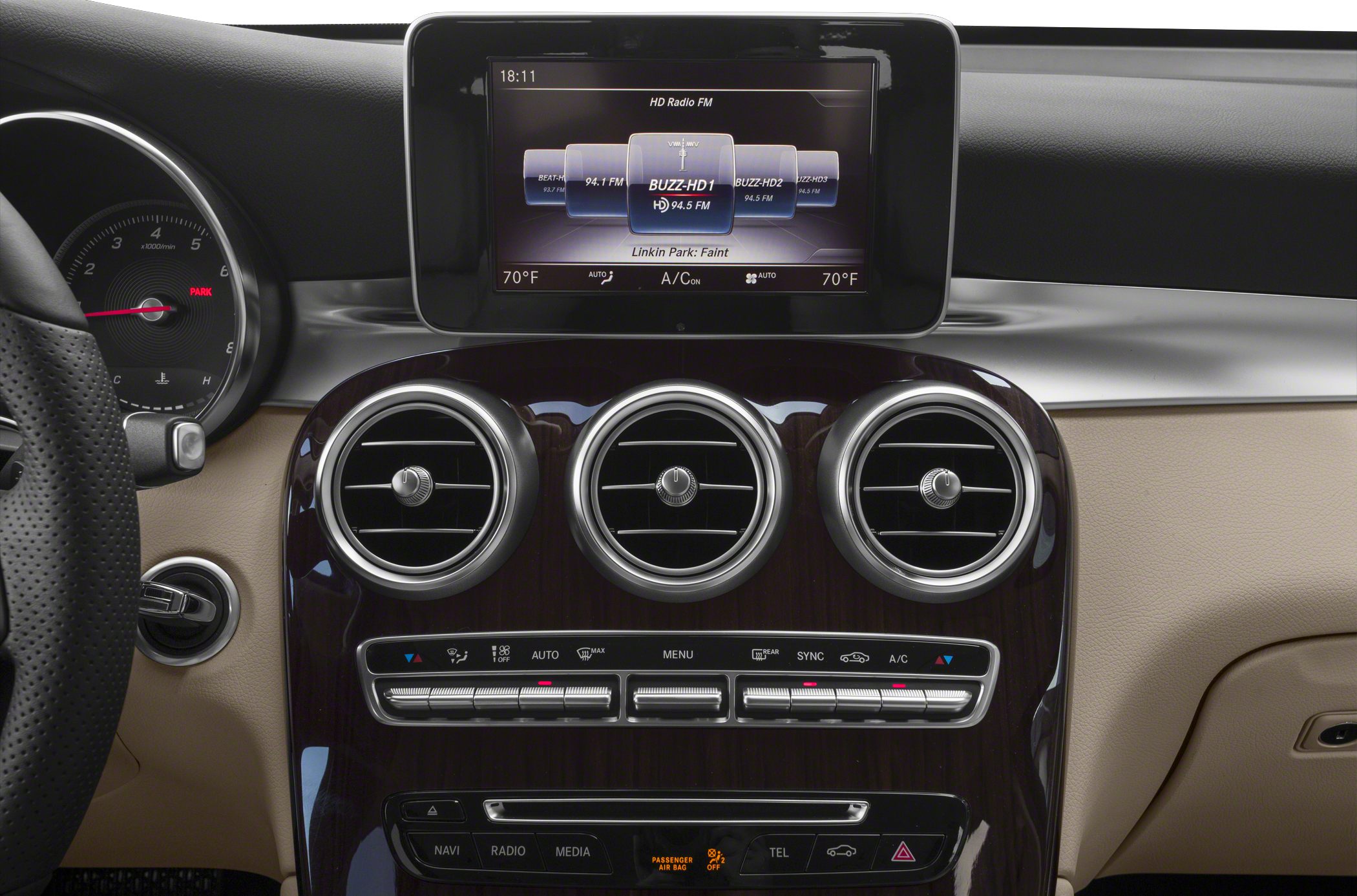Infotainment screen and circular air vents with climate controls
