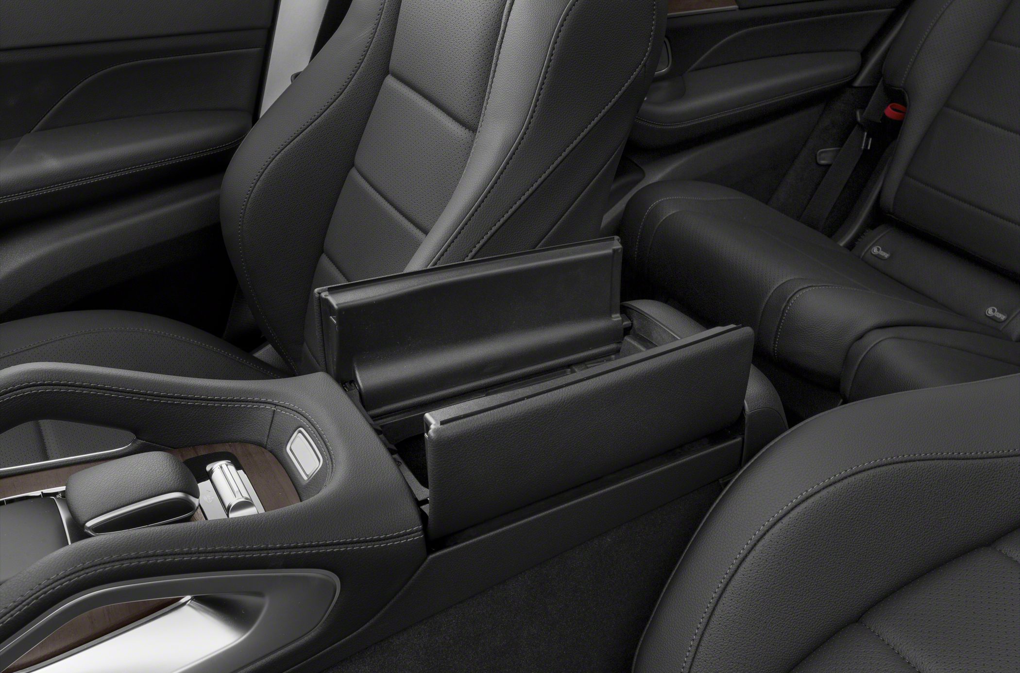 Black leather seats and open center console storage in vehicle interior
