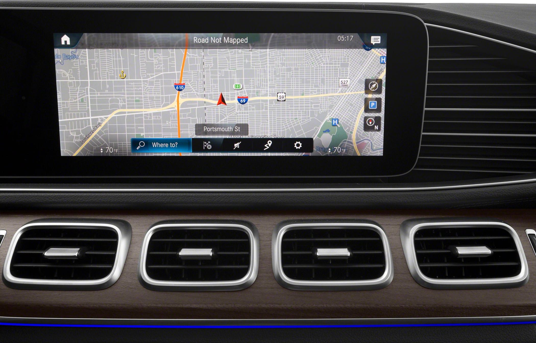 Large infotainment navigation display and four air vents with wood trim