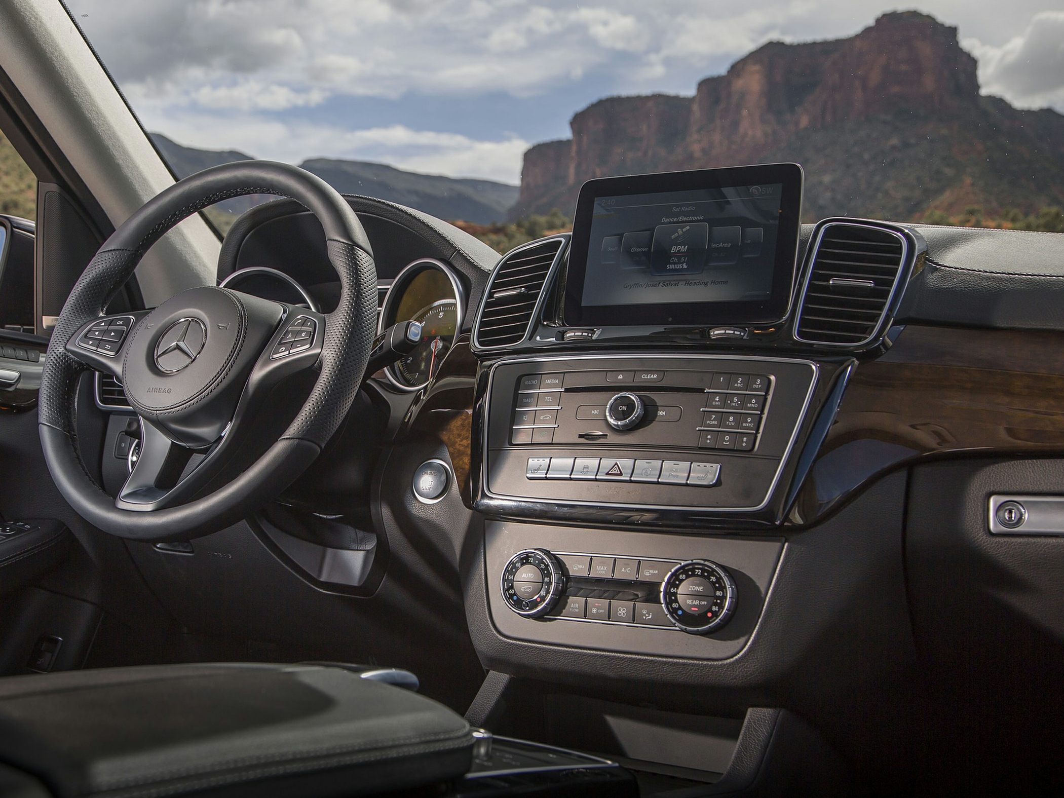 Luxurious SUV dashboard with infotainment screen and climate controls