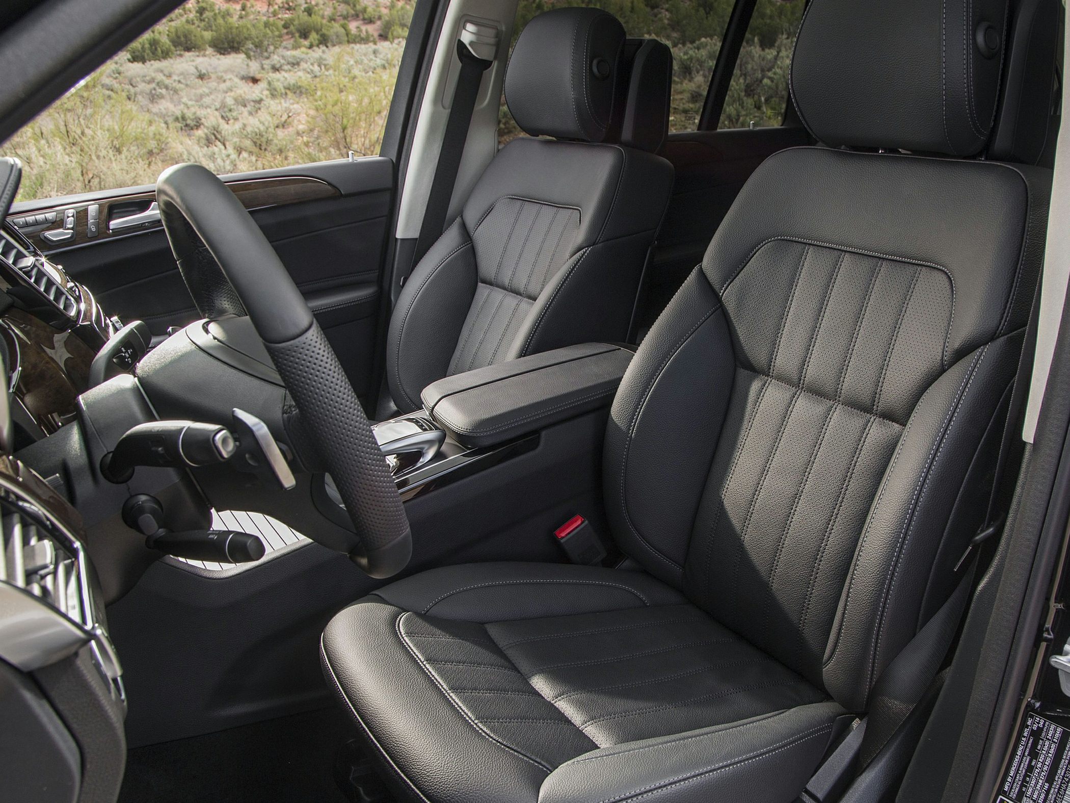 Black leather front seats with detailed stitching and luxury interior trim