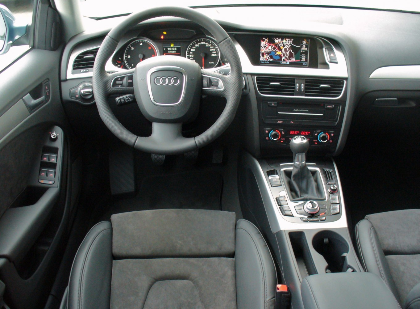 Audi-style steering wheel and digital dashboard with center console controls