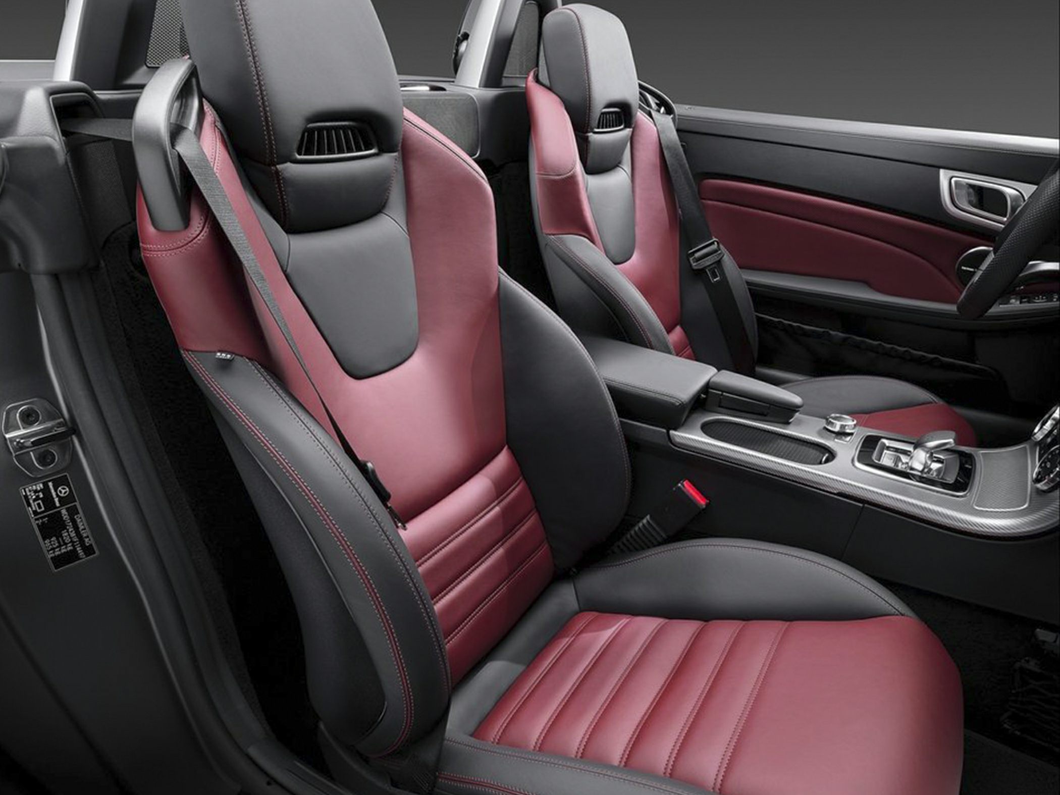 Leather sport seats and center console interior with red and black colors