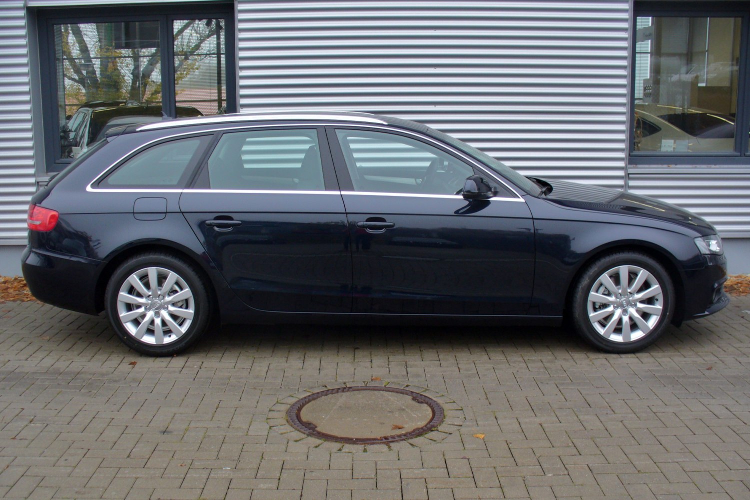 Side profile of a sleek station wagon with alloy wheels