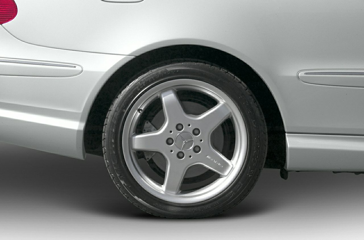 Close-up of AMG 5-spoke alloy wheel and tire