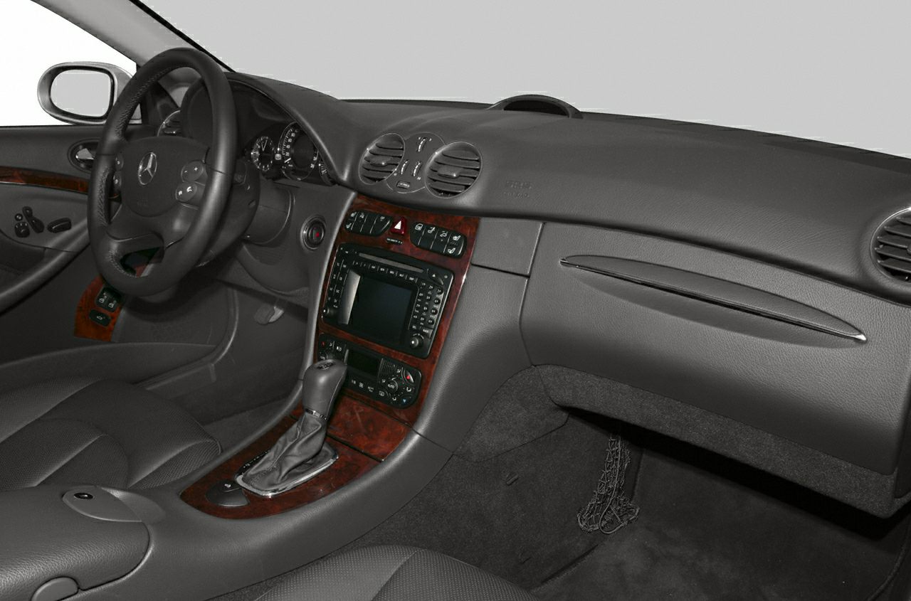 Luxury car interior with wood trim dashboard and center console