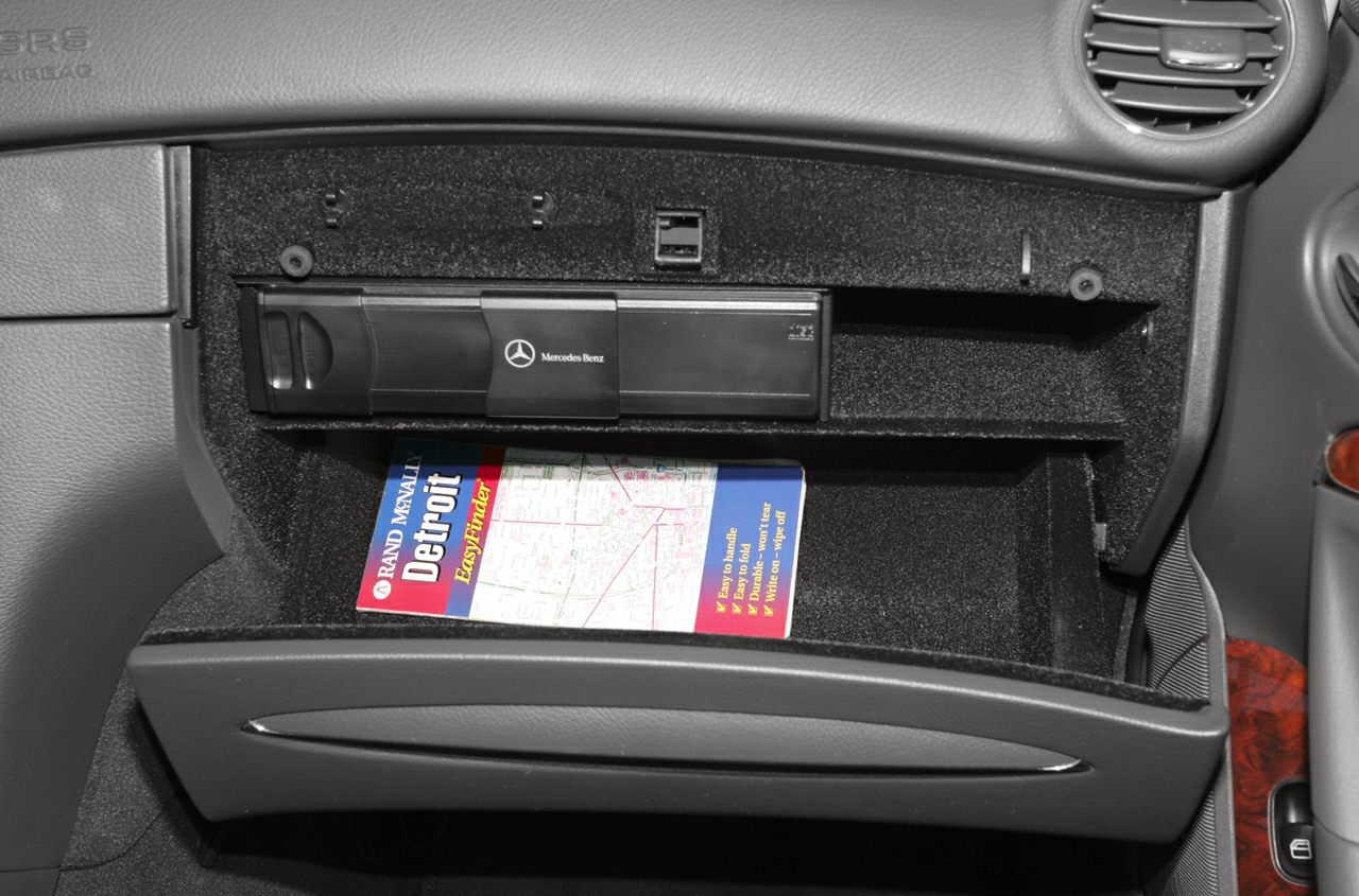 Glovebox with integrated navigation system storage and map inside
