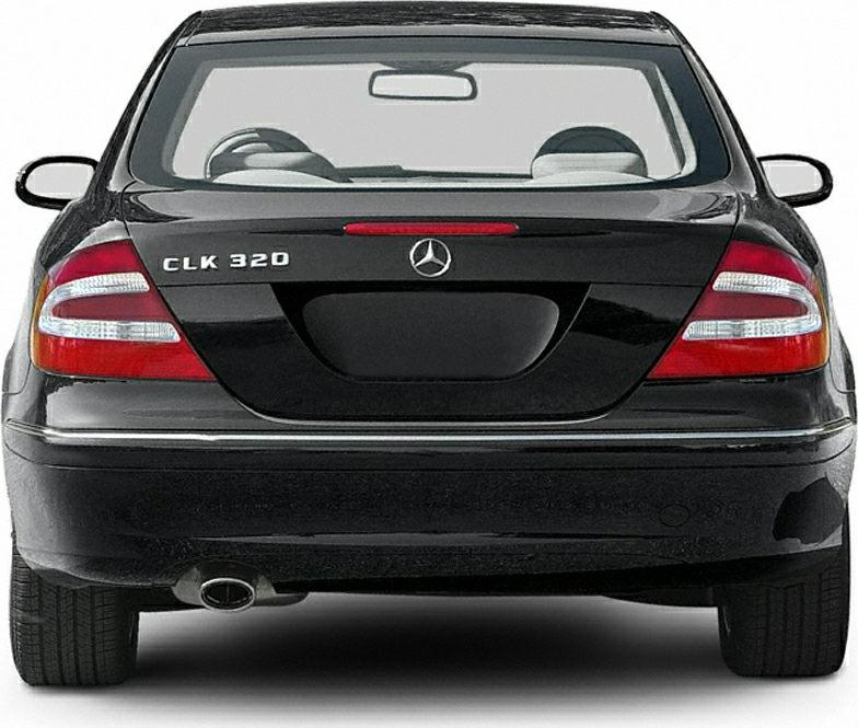 Rear view of a Mercedes-Benz coupe with taillights and single exhaust.