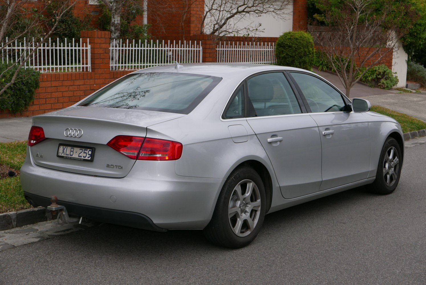 Silver sedan rear and side view with LED tail lights and alloy wheels