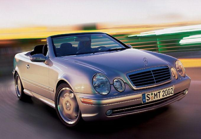 Front view of a luxury convertible with distinctive headlights and grille