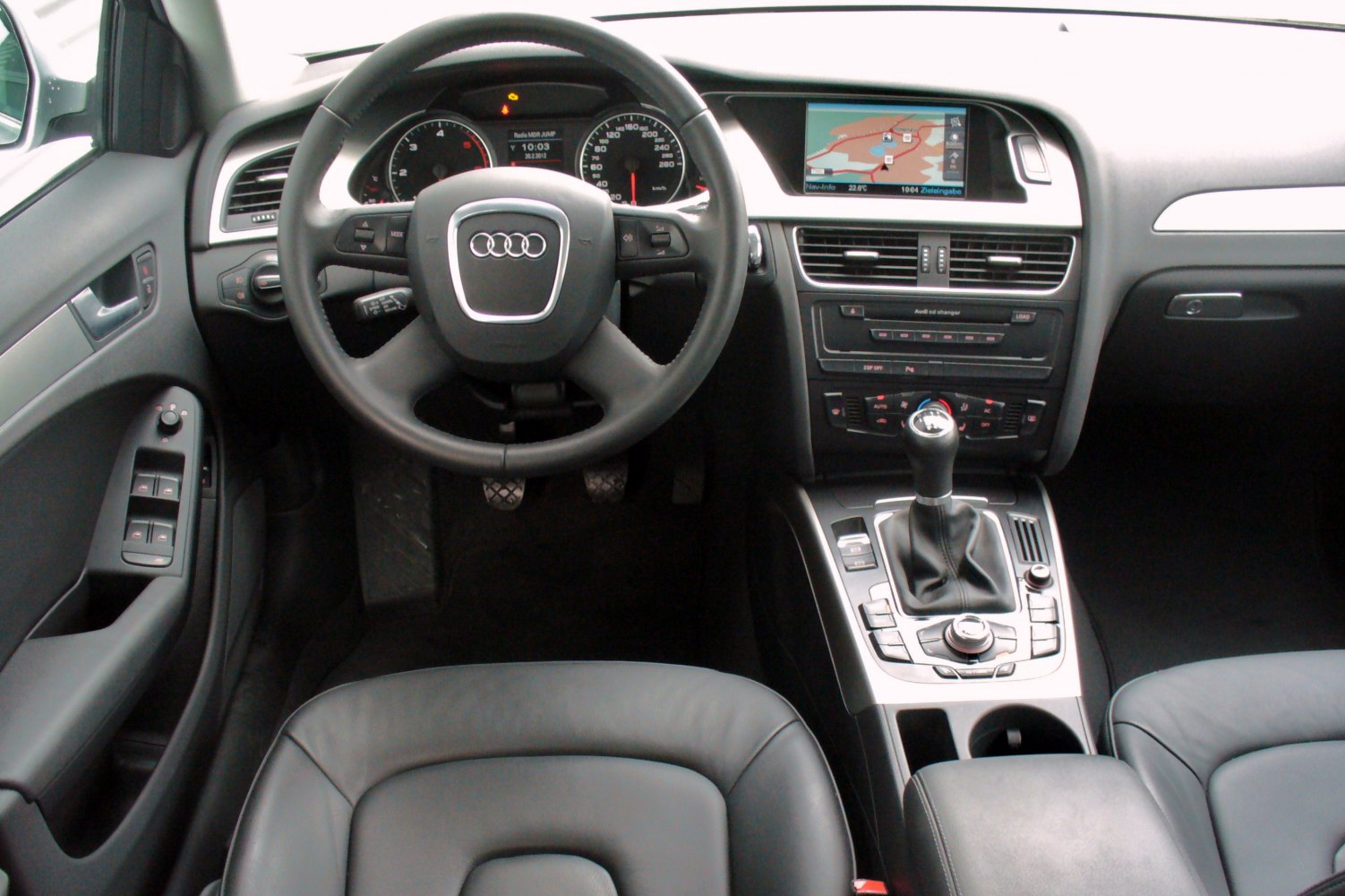 Audi interior with manual gear shifter and navigation system