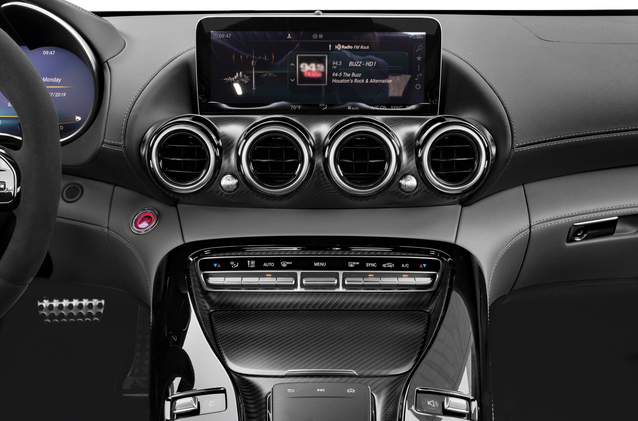 Dashboard with circular air vents and infotainment display