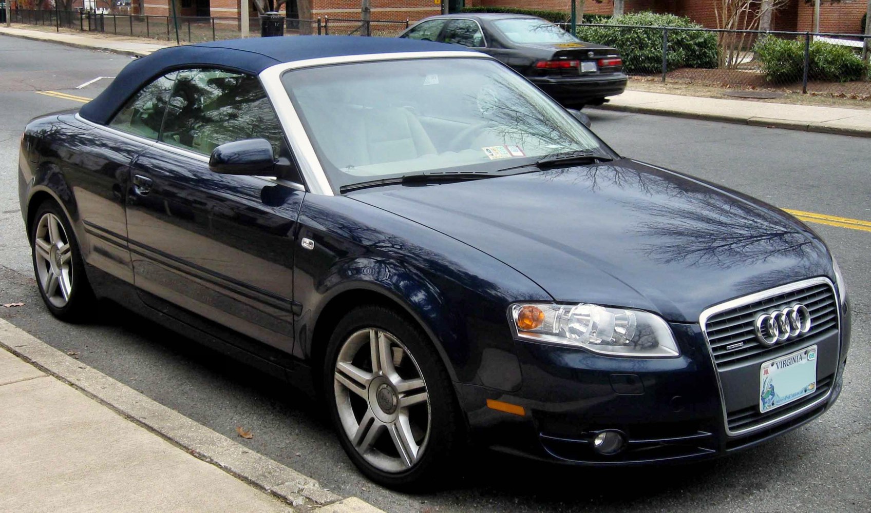 Convertible soft top and front-side view with alloy wheels