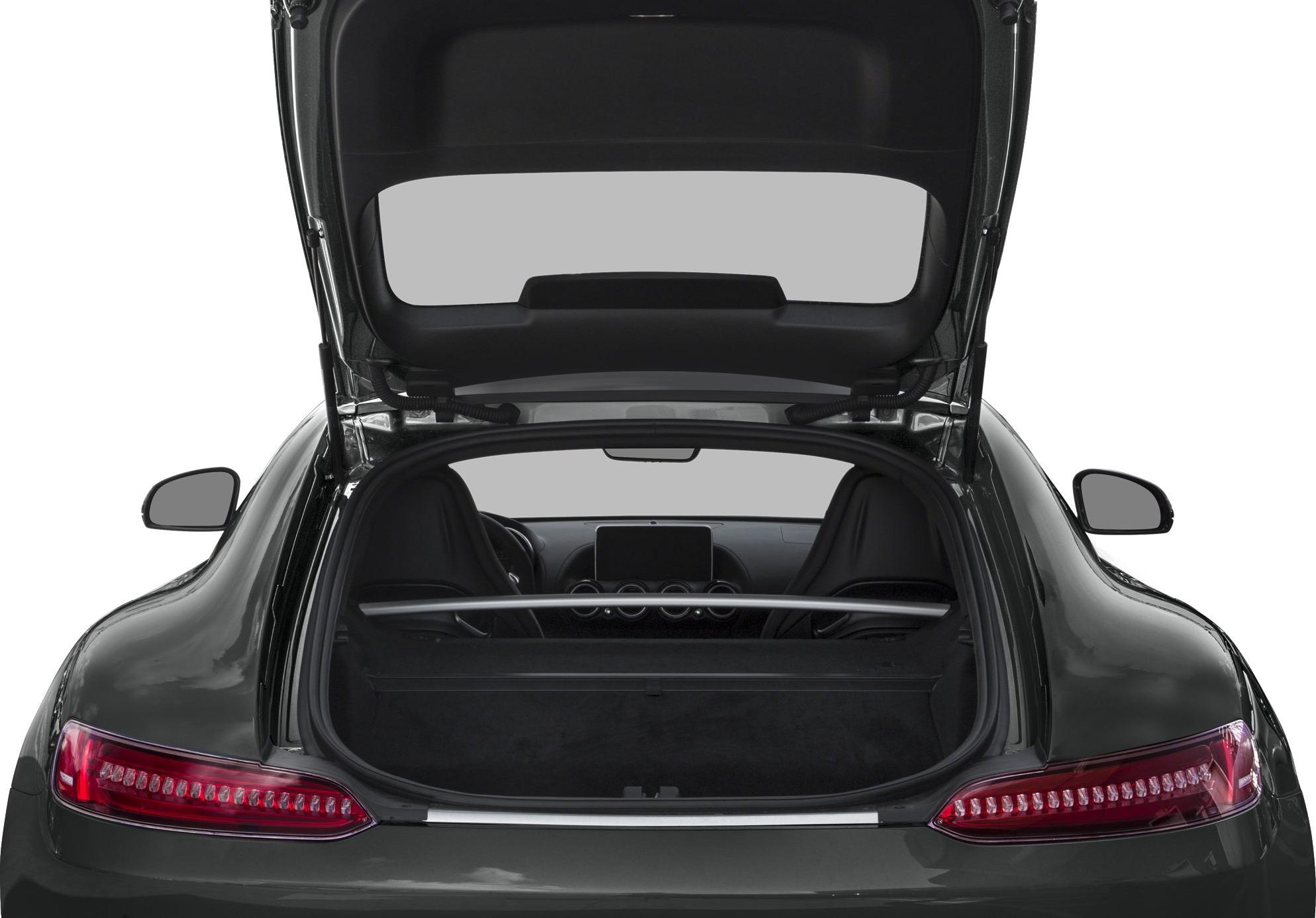 Open trunk with rear seats and infotainment system in a sporty coupe