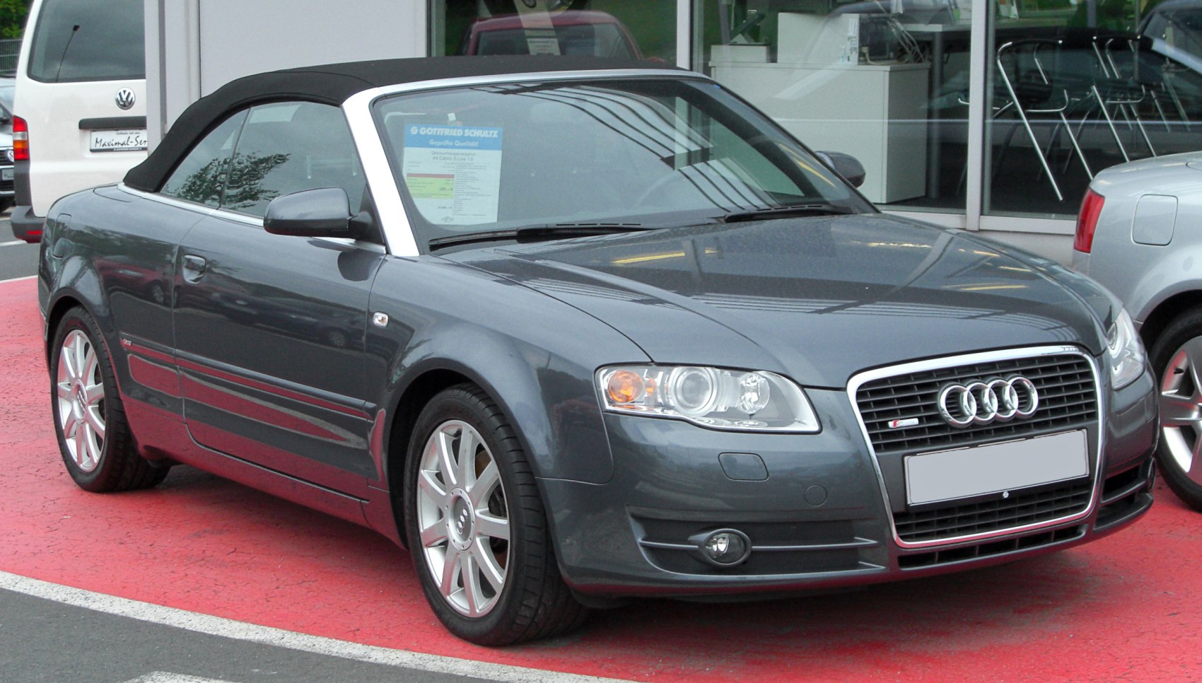 Front view of convertible with soft top and chrome-framed grille