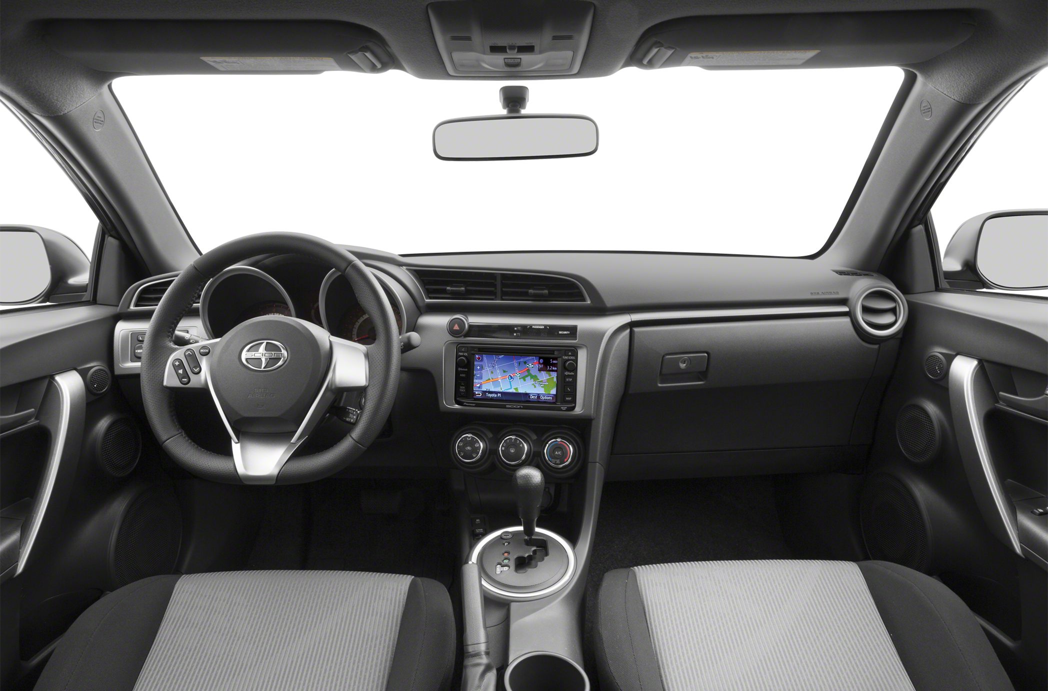 Dashboard with navigation display and multifunction steering wheel in sporty compact car.