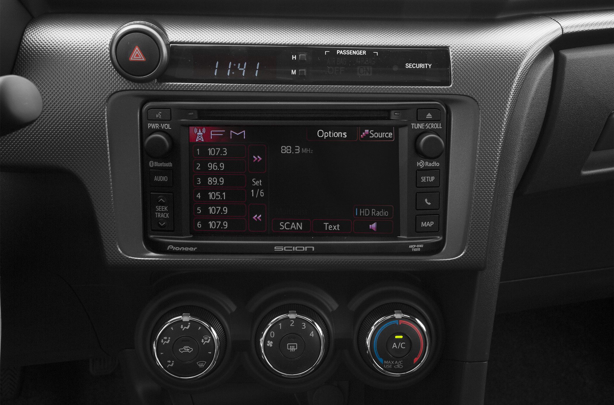 Center console with touchscreen audio system and manual climate controls