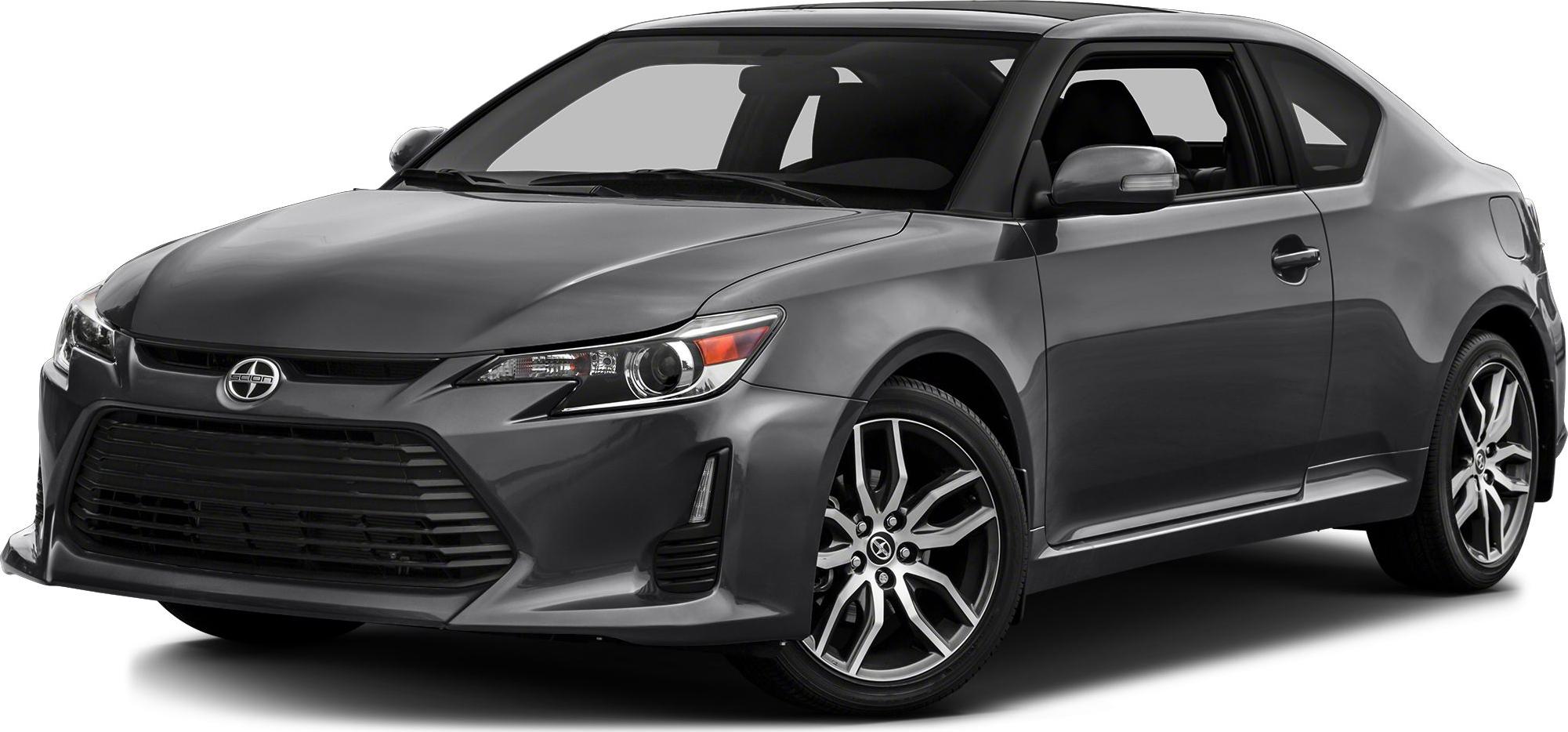 Gray compact coupe with sleek headlights and alloy wheels