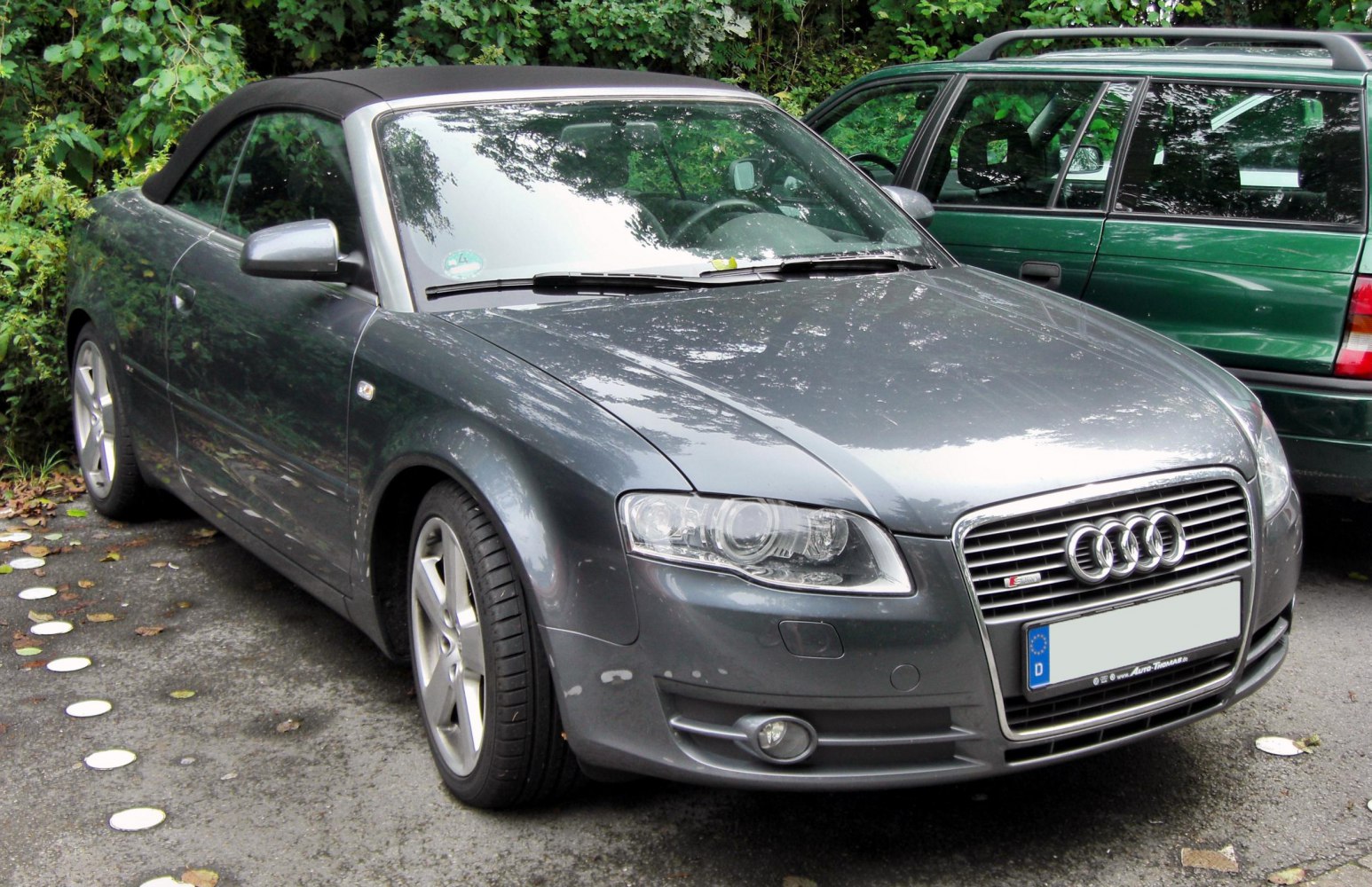 Front view of convertible with soft-top and distinctive grille