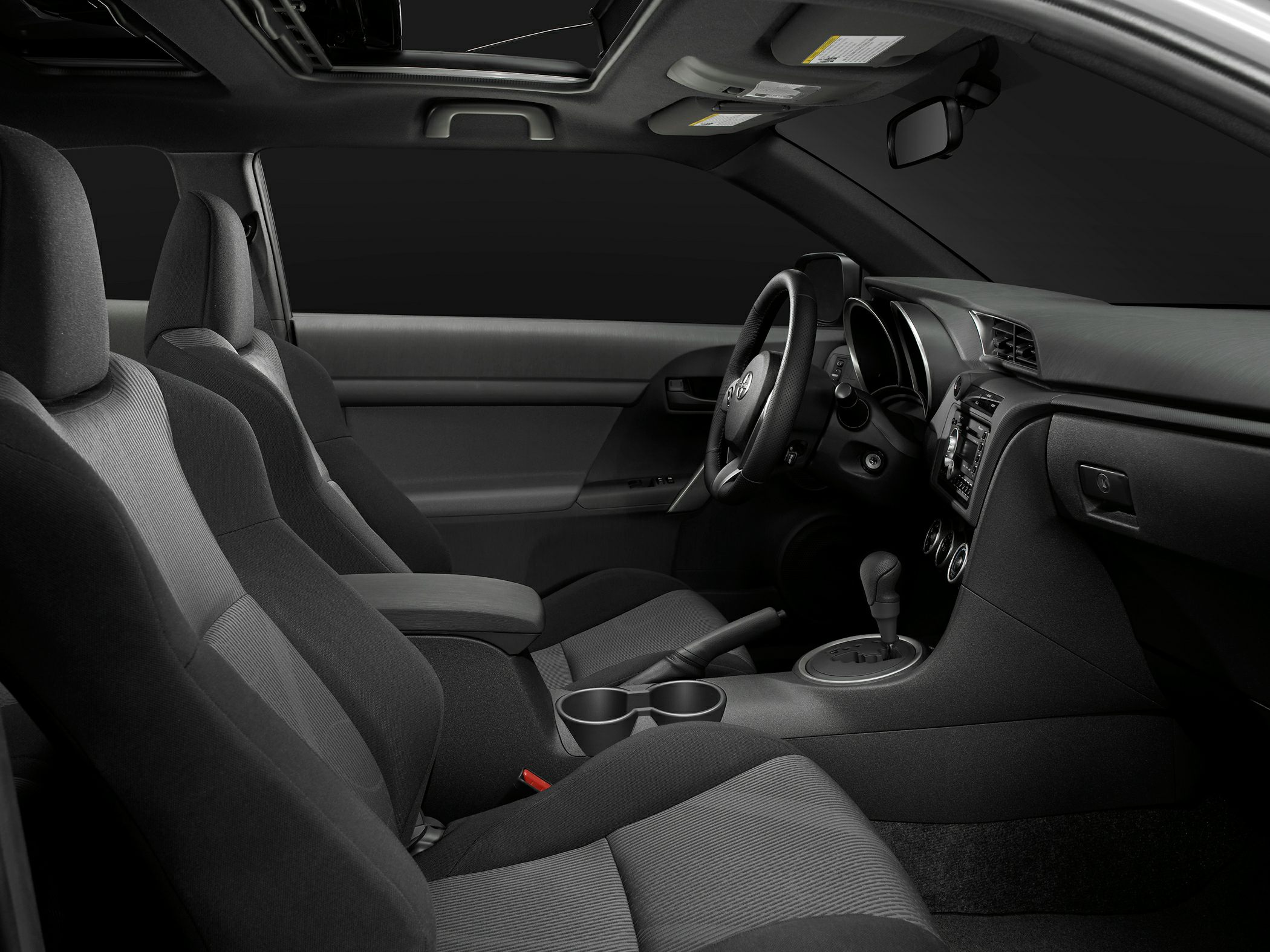 Black fabric seats, manual gear shift, modern dashboard