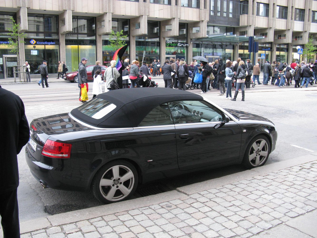 Black convertible with soft-top roof and alloy wheels