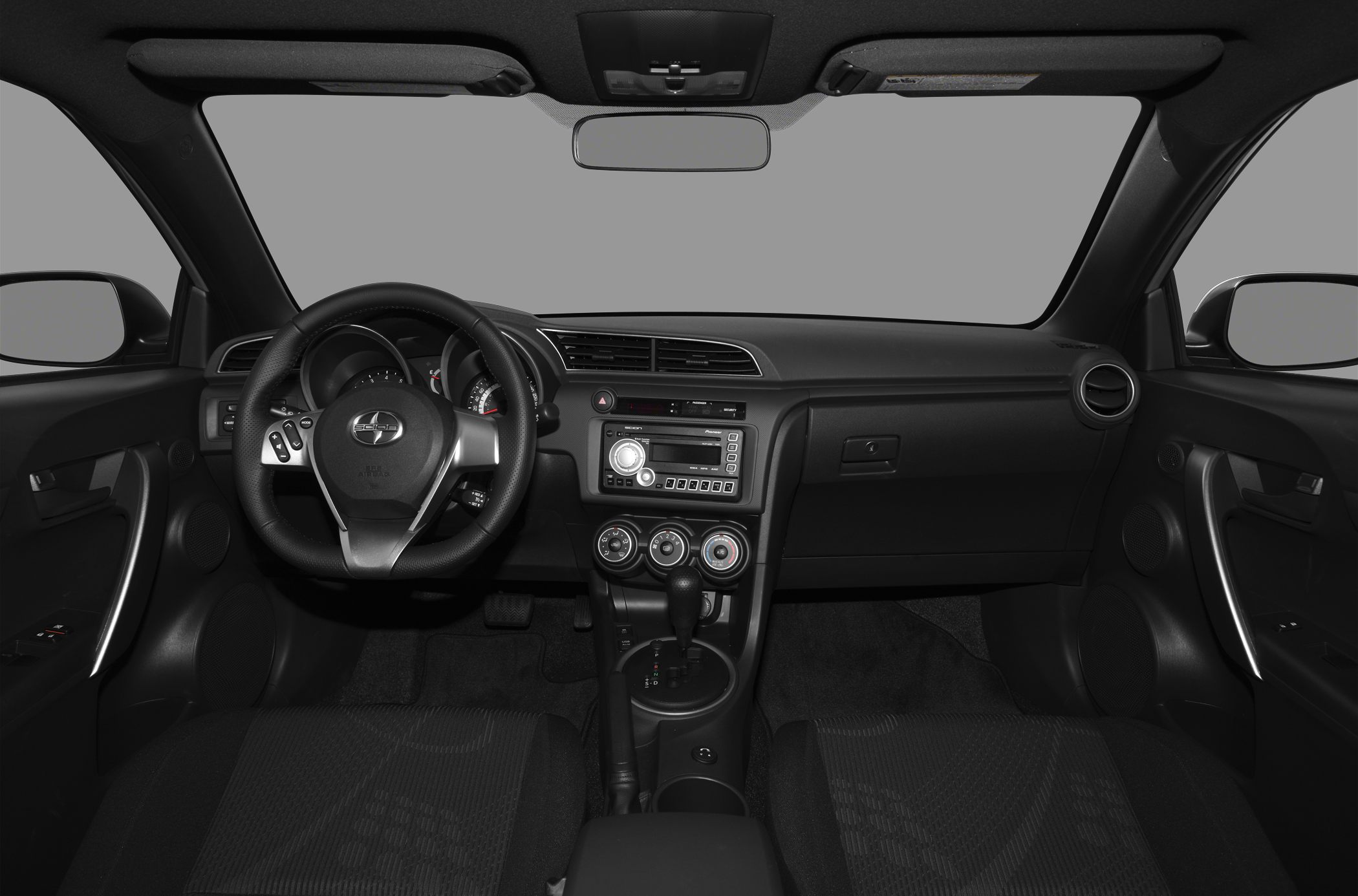 Dashboard, steering wheel, center console with controls inside vehicle