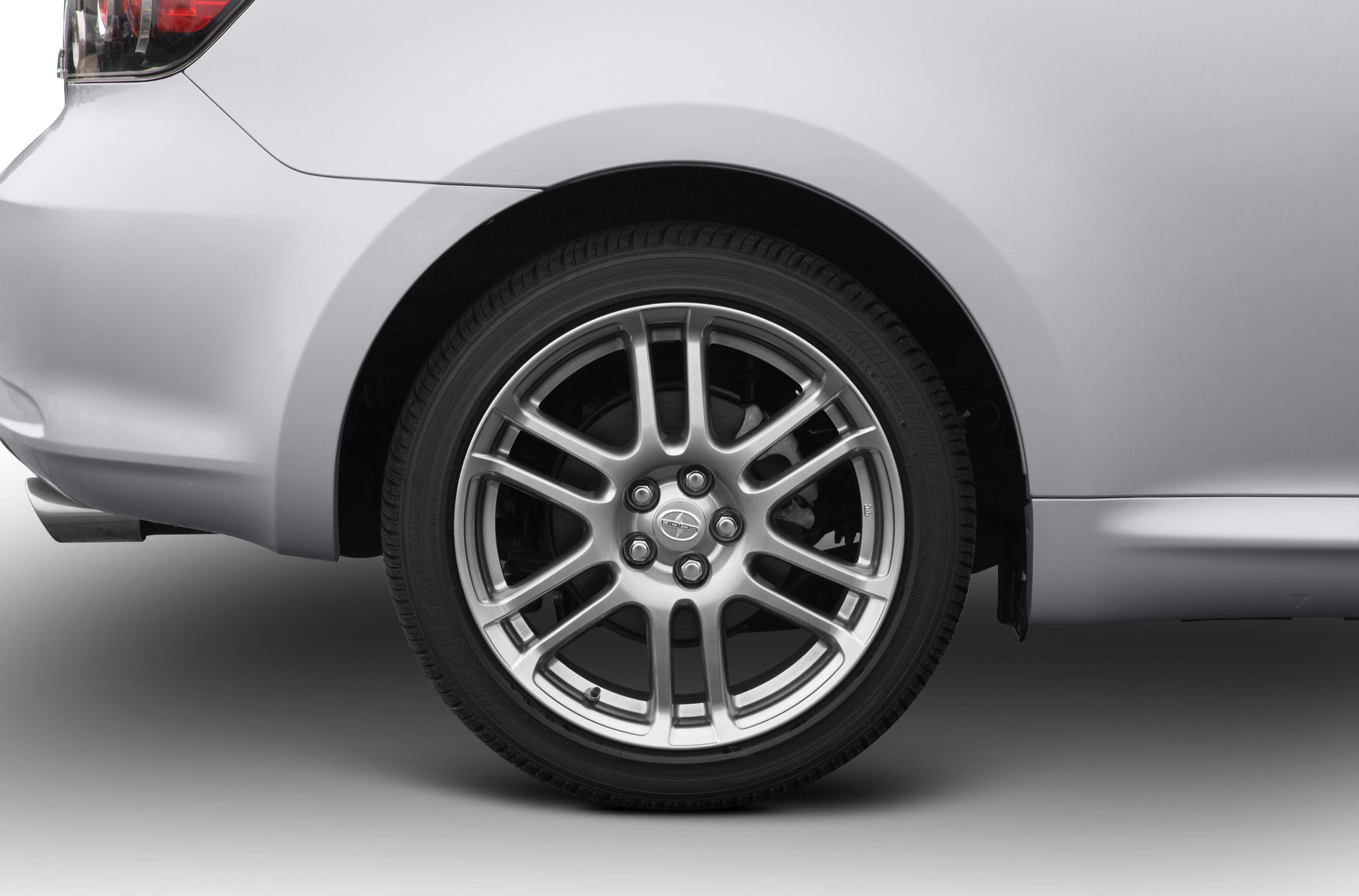 Close-up of rear alloy wheel and tire