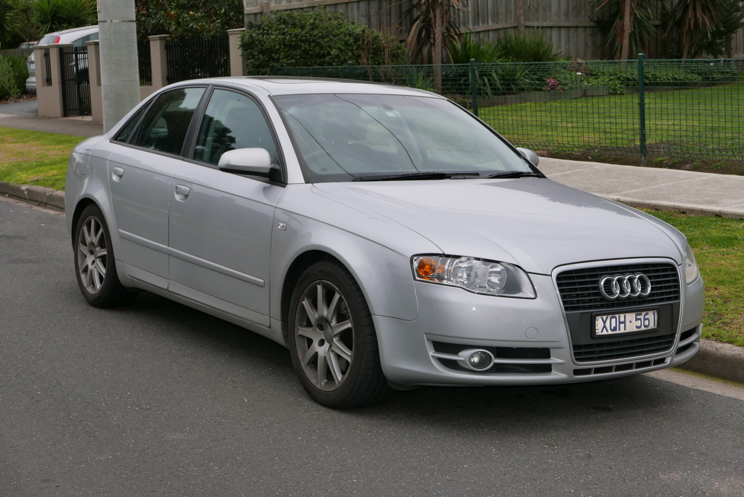 Silver sedan with distinctive grille and headlights, alloy wheels