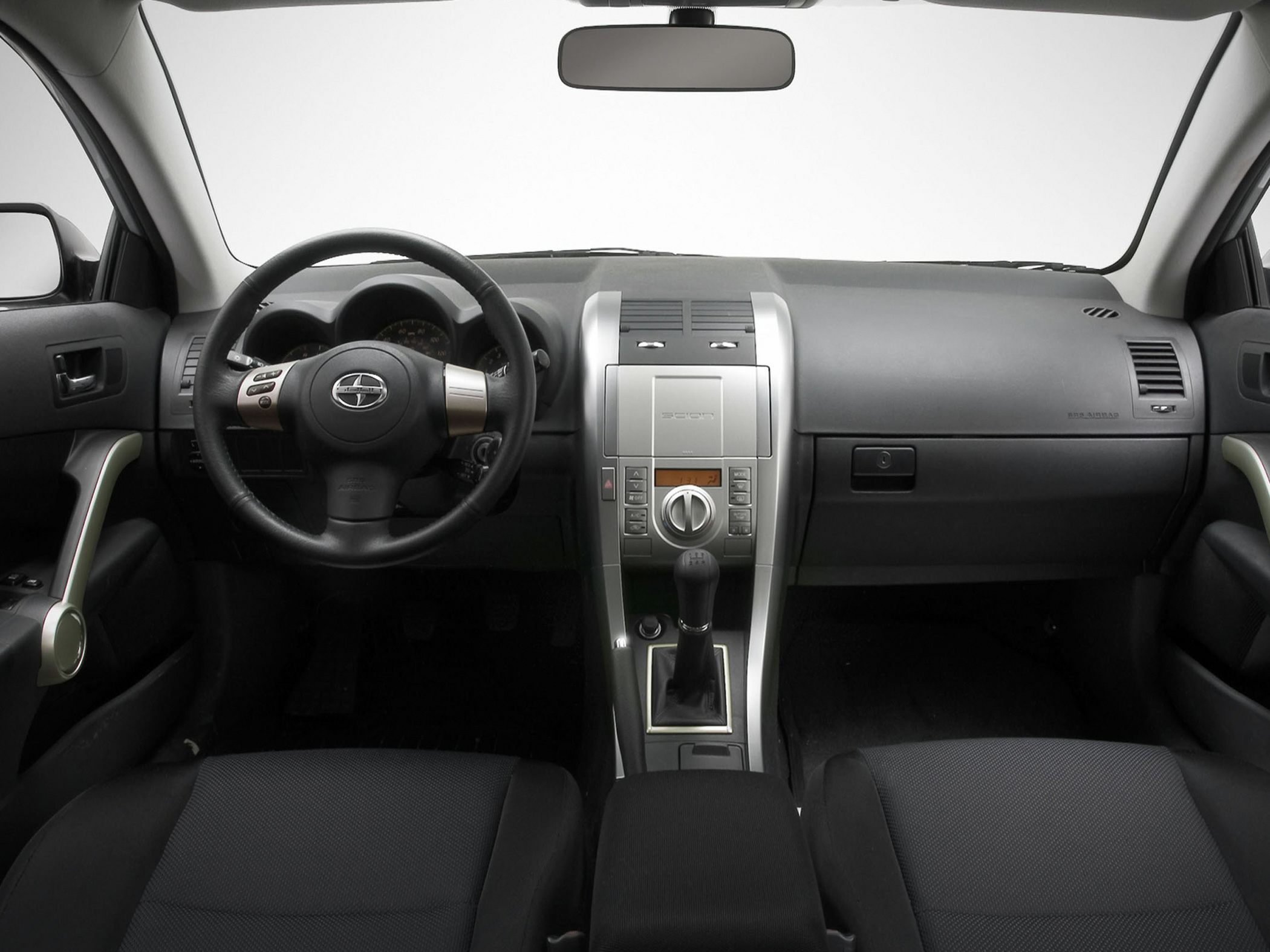 Dashboard, steering wheel, and manual gear shift interior design