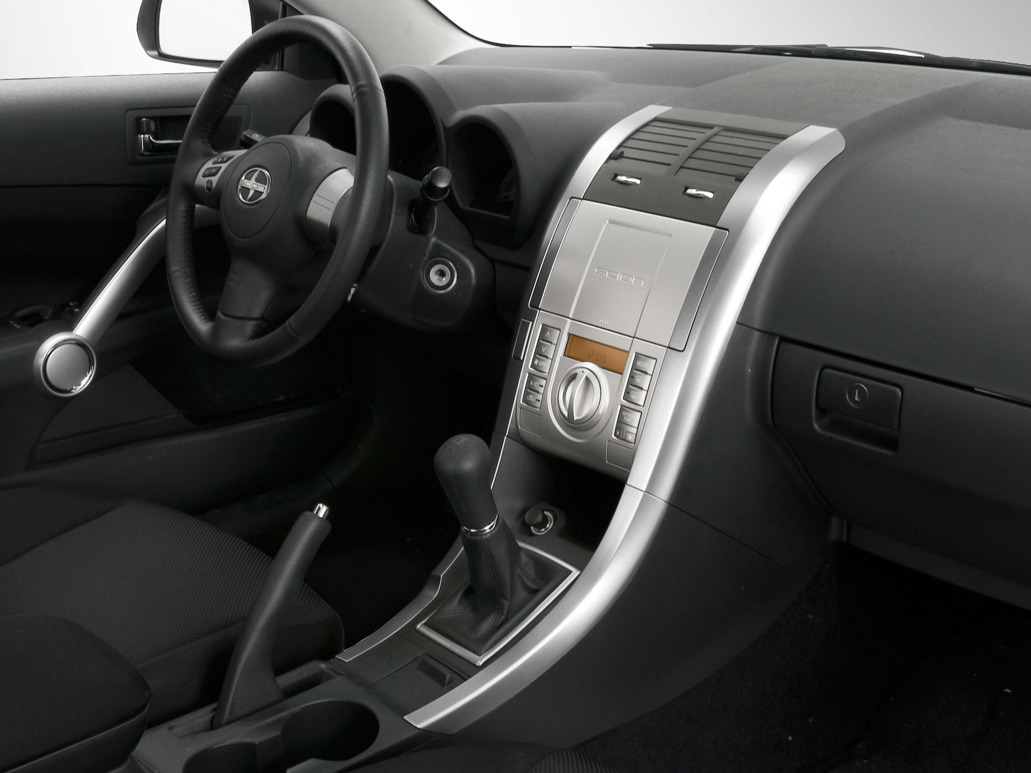 Interior dashboard and manual gear shift with center console and steering wheel