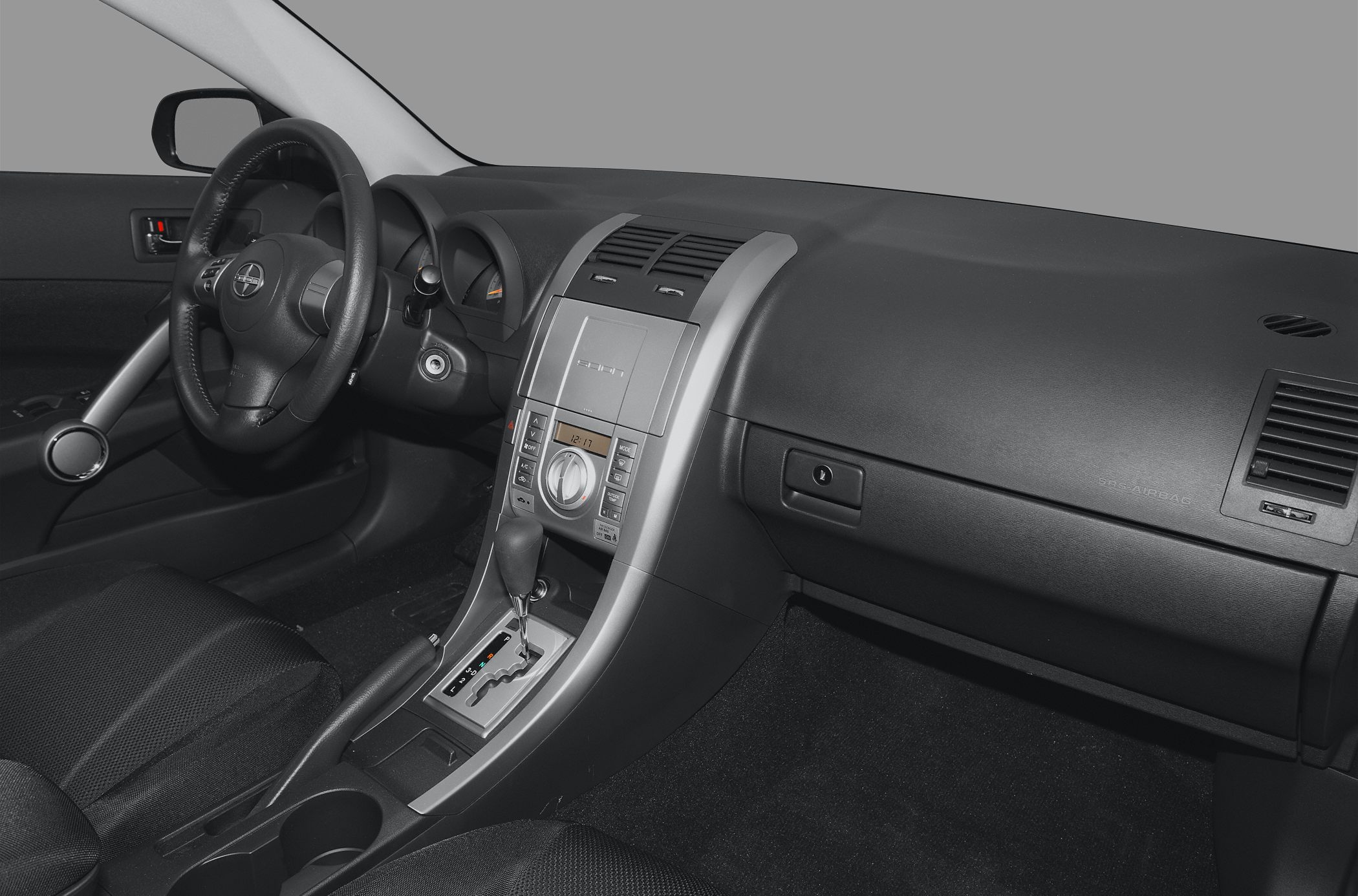 Dashboard and center console with steering wheel and automatic gear shifter