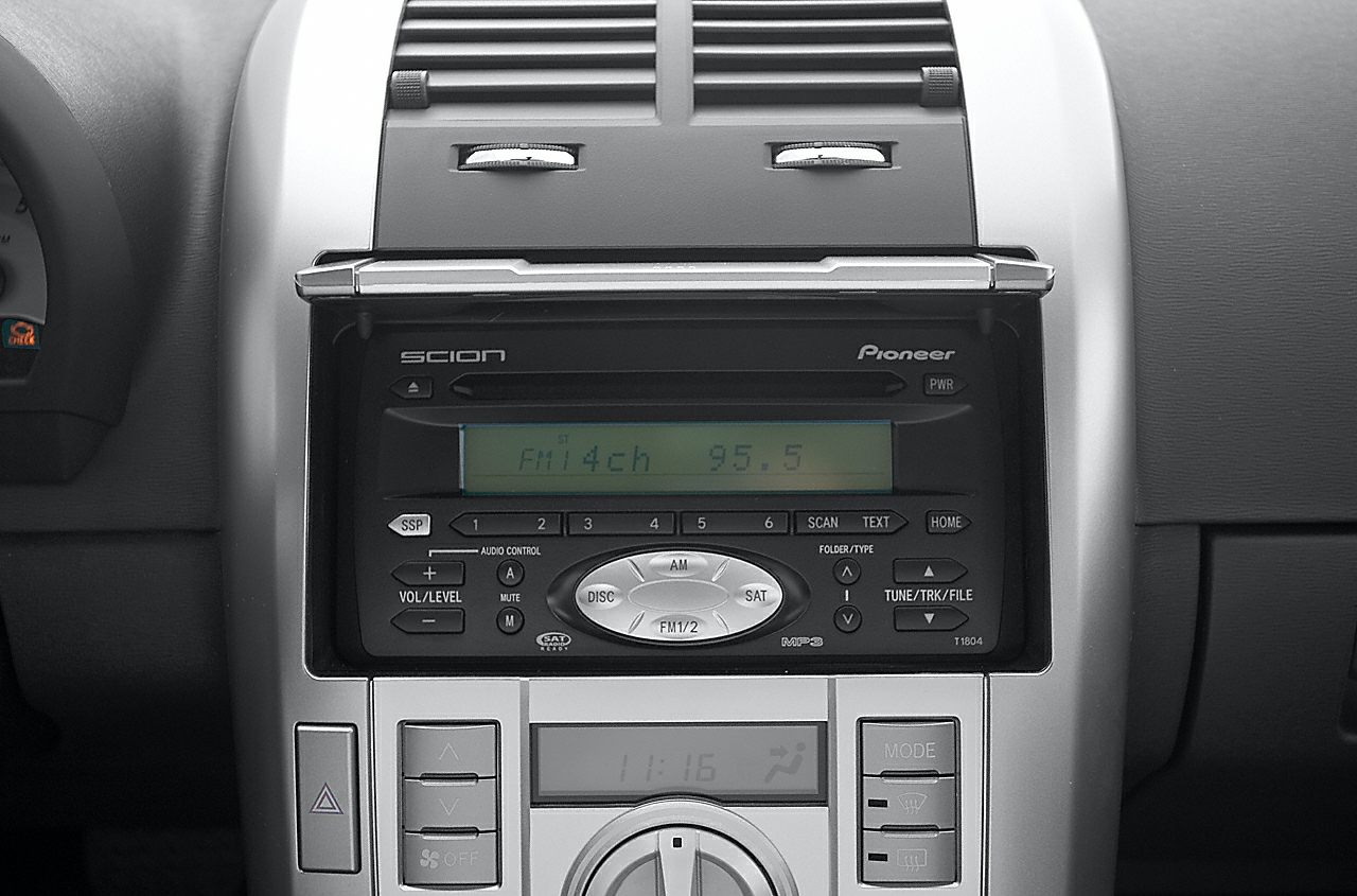 Close-up of a car center console showcasing Pioneer stereo system and climate control
