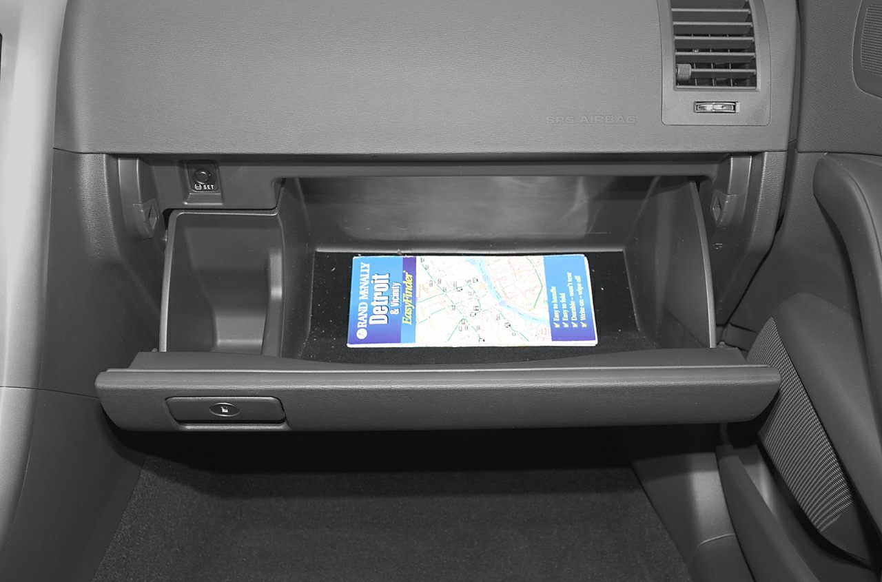Open glove compartment with map inside