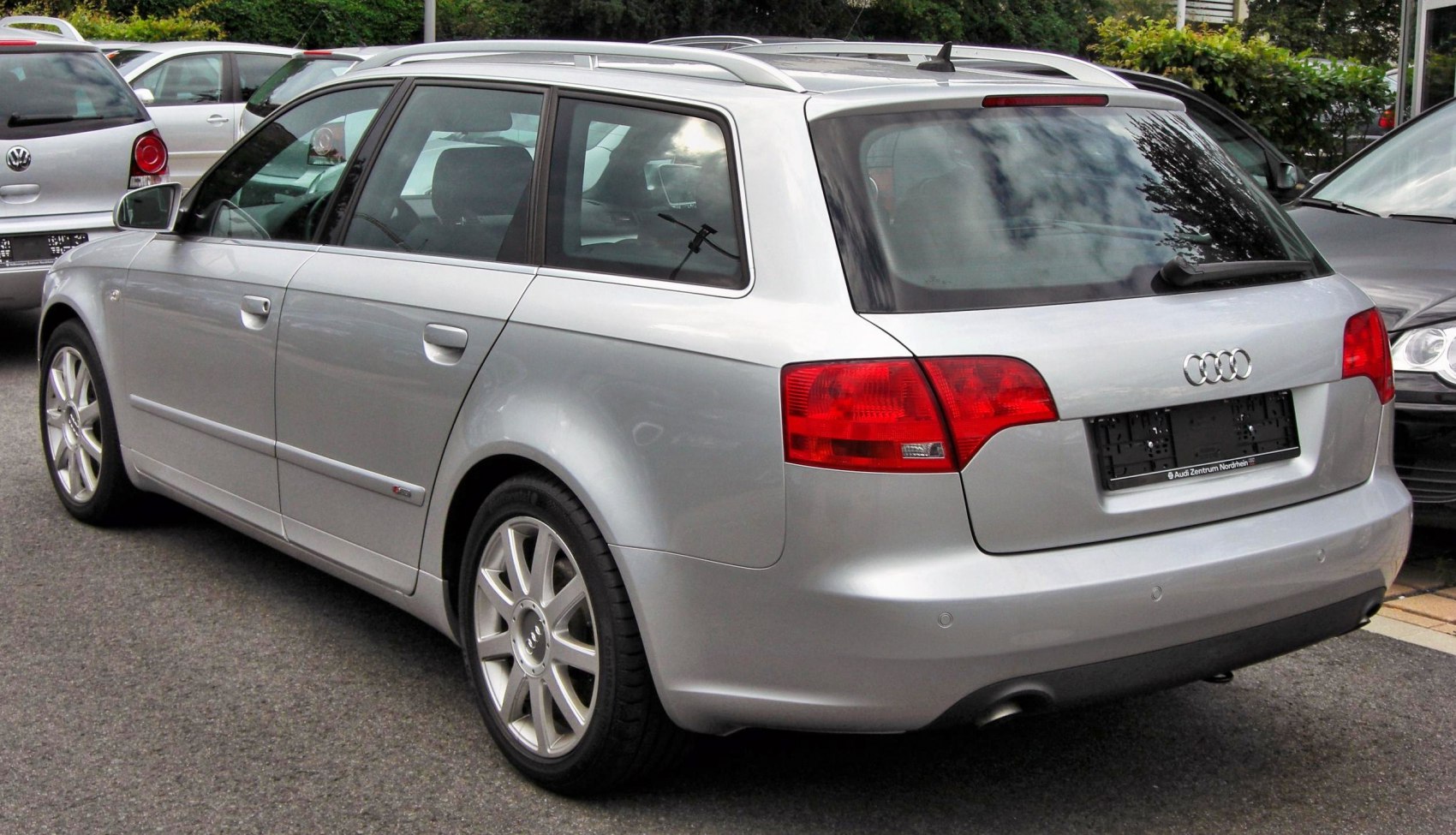 Silver estate car rear view with roof rails and alloy wheels