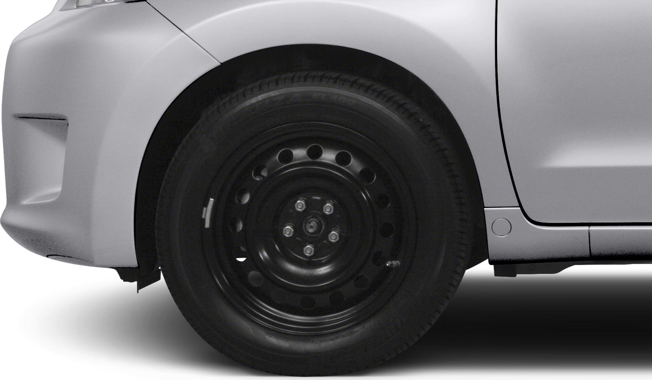 Steel wheel with tire on front wheel arch and car door side