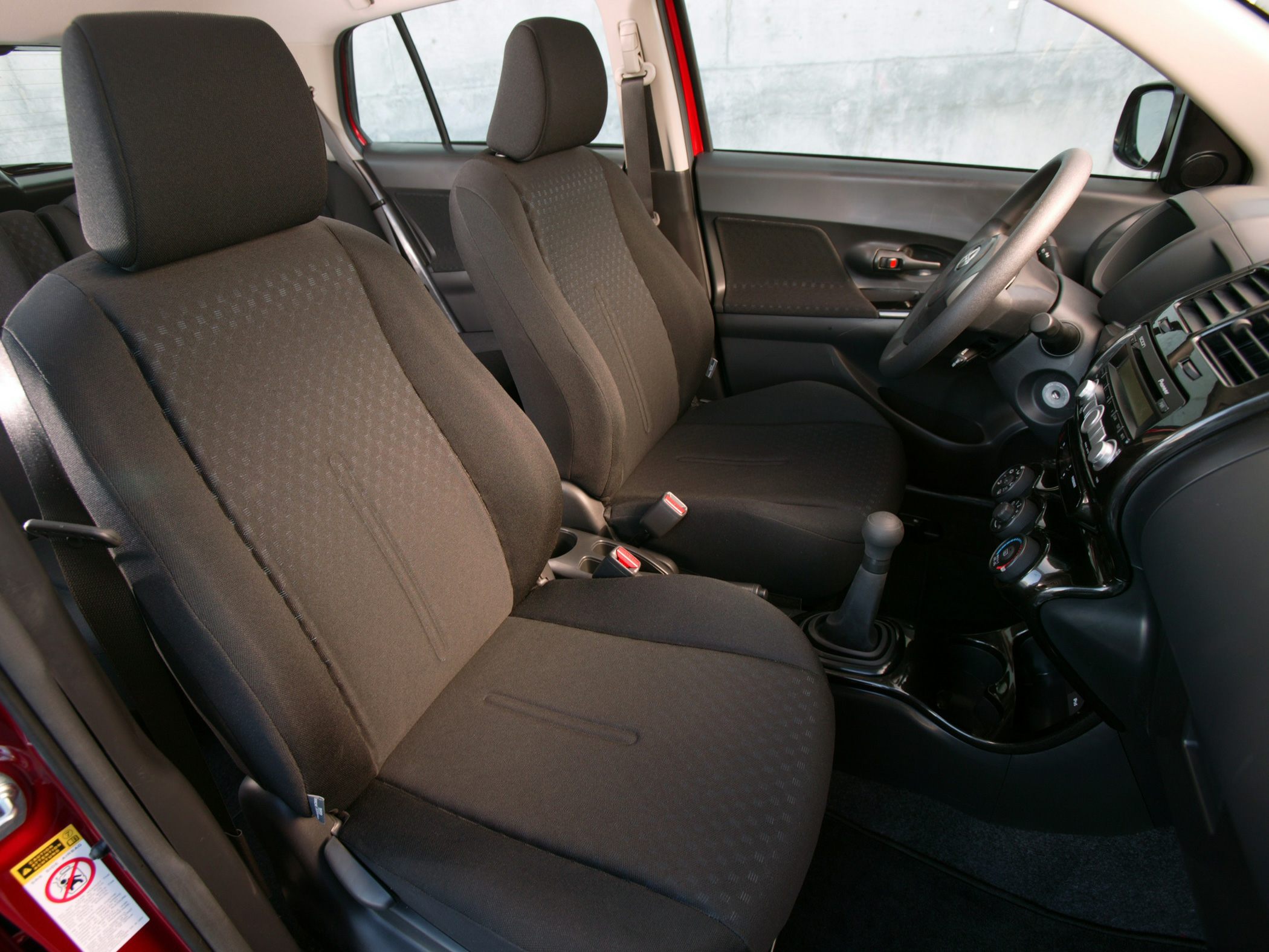 Front seats and dashboard interior with manual gear shift
