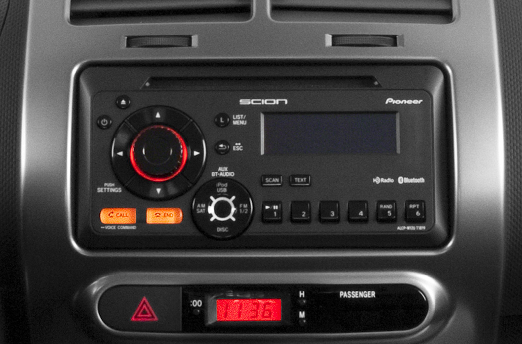 Car dashboard with stereo controls and digital clock display
