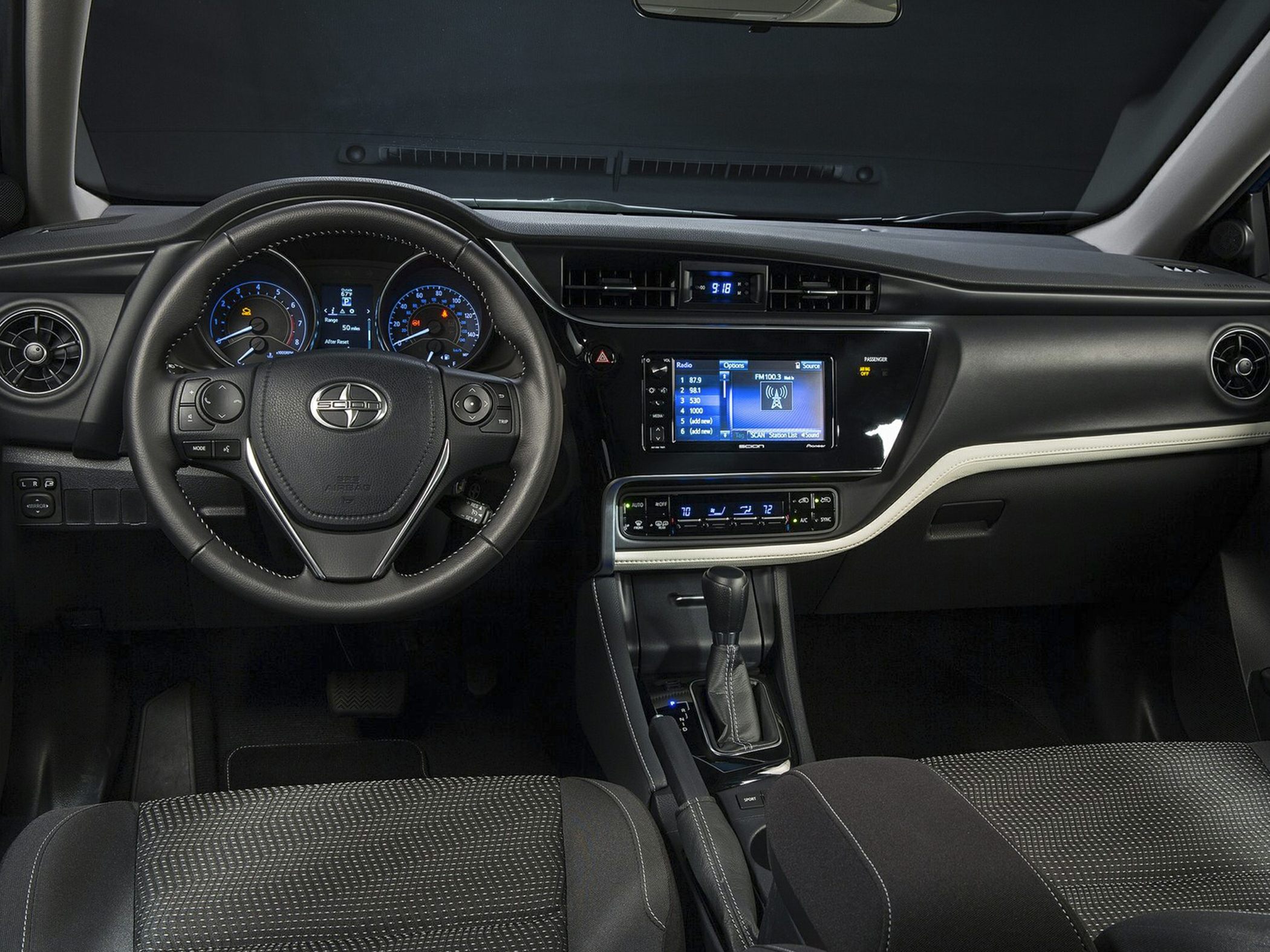 Car interior dashboard with steering wheel and infotainment system