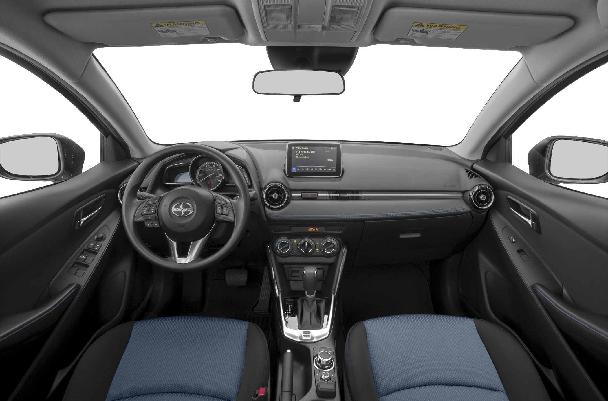 Car interior with dashboard, steering wheel, center console, and infotainment screen